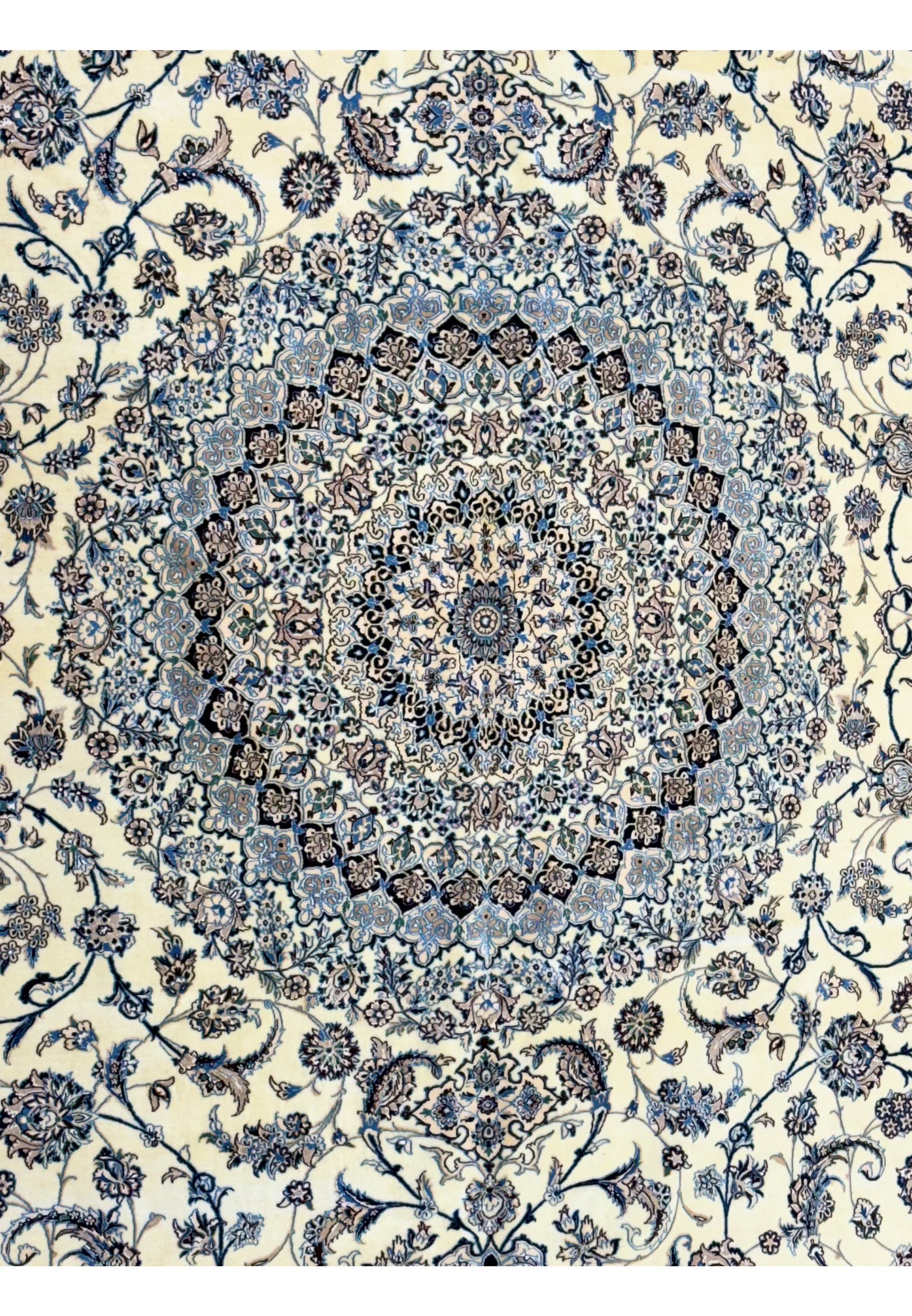 Detailed view of the floral patterns on a 13 x 20 Persian Nain 9LAA Wool & Silk Rug's central medallion.