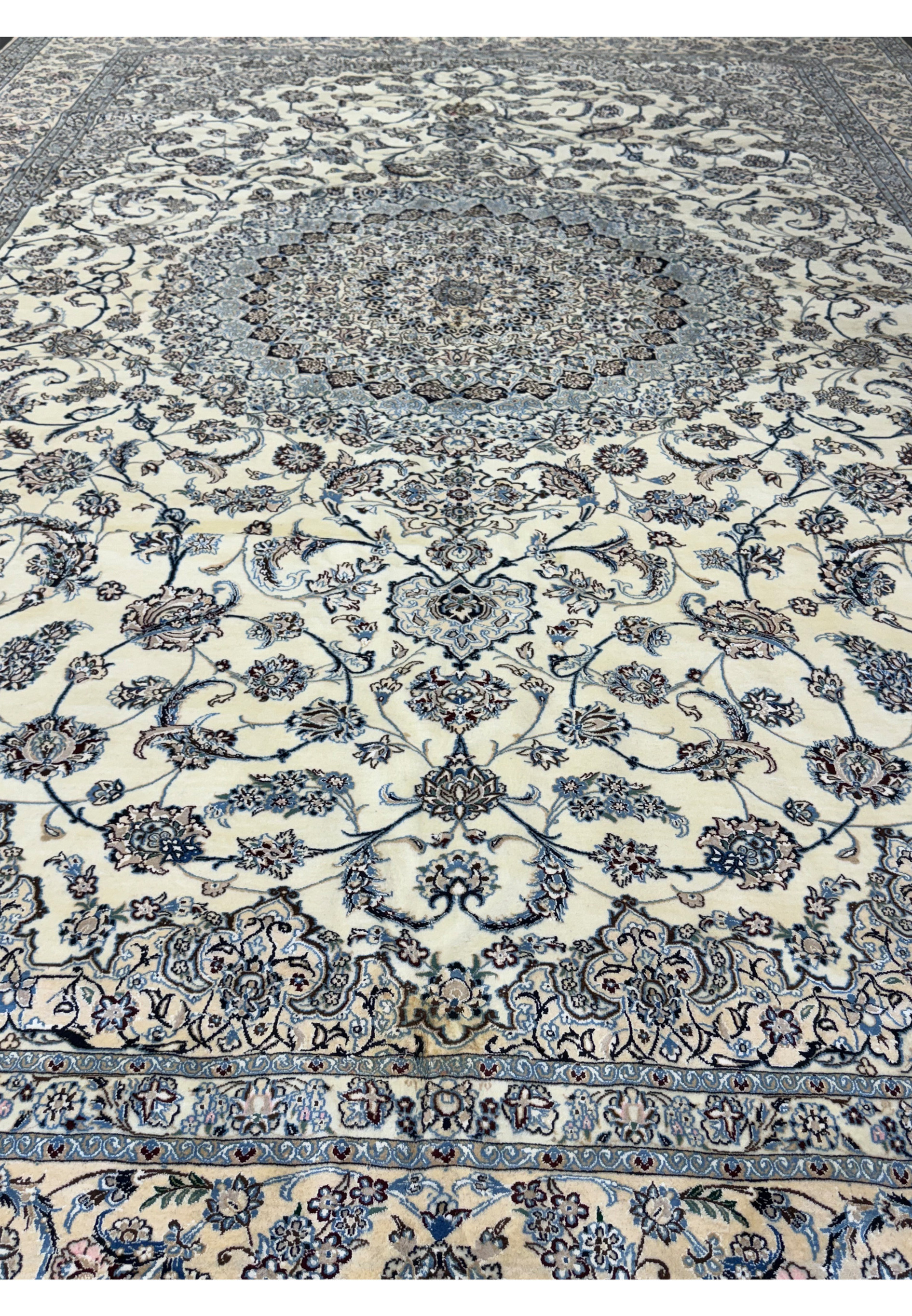 Overview of the Persian Nain 9LAA Wool & Silk Rug showing the detailed floral design.
