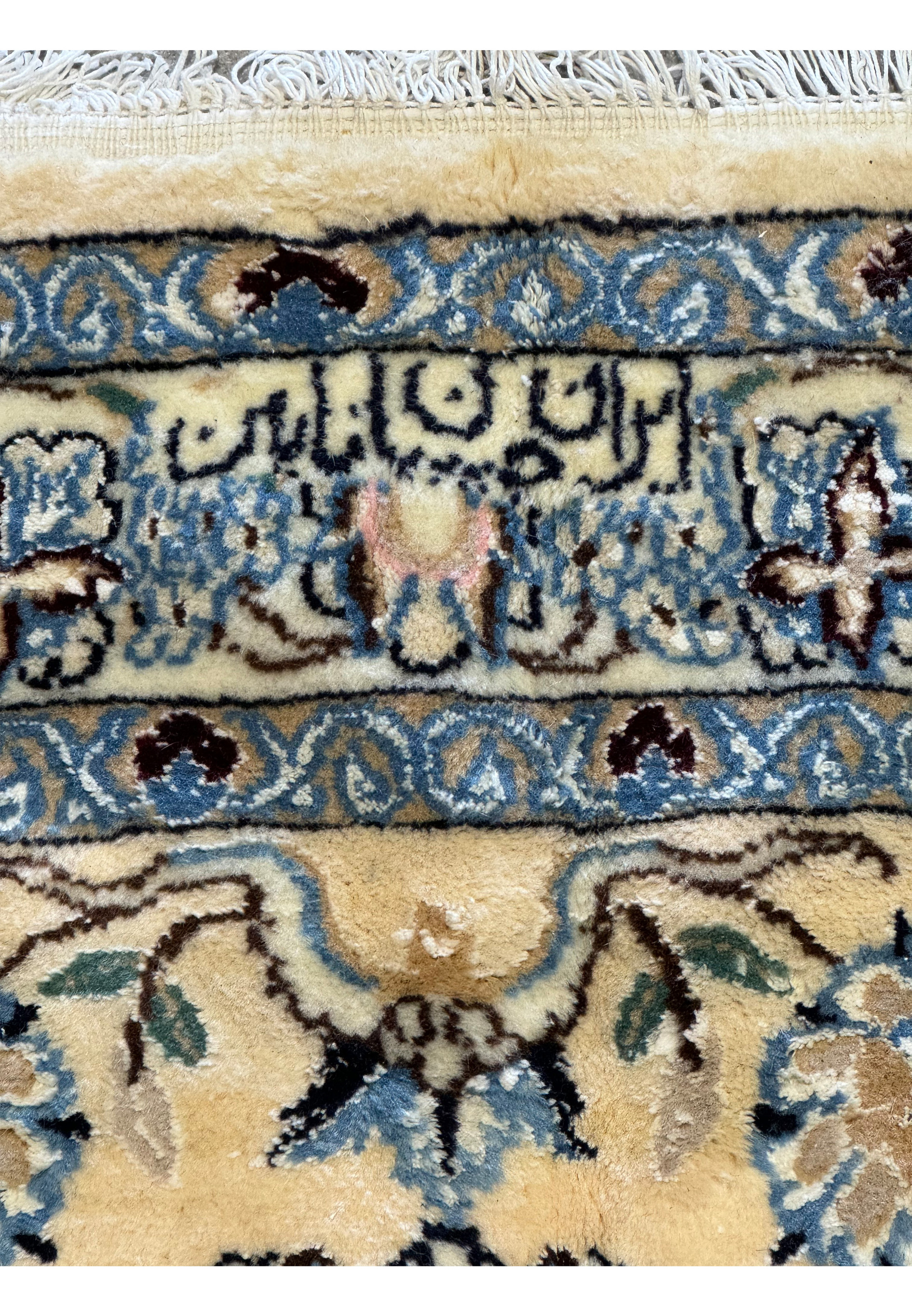 Signature area close-up on a Persian Nain 9LAA Wool & Silk Rug.