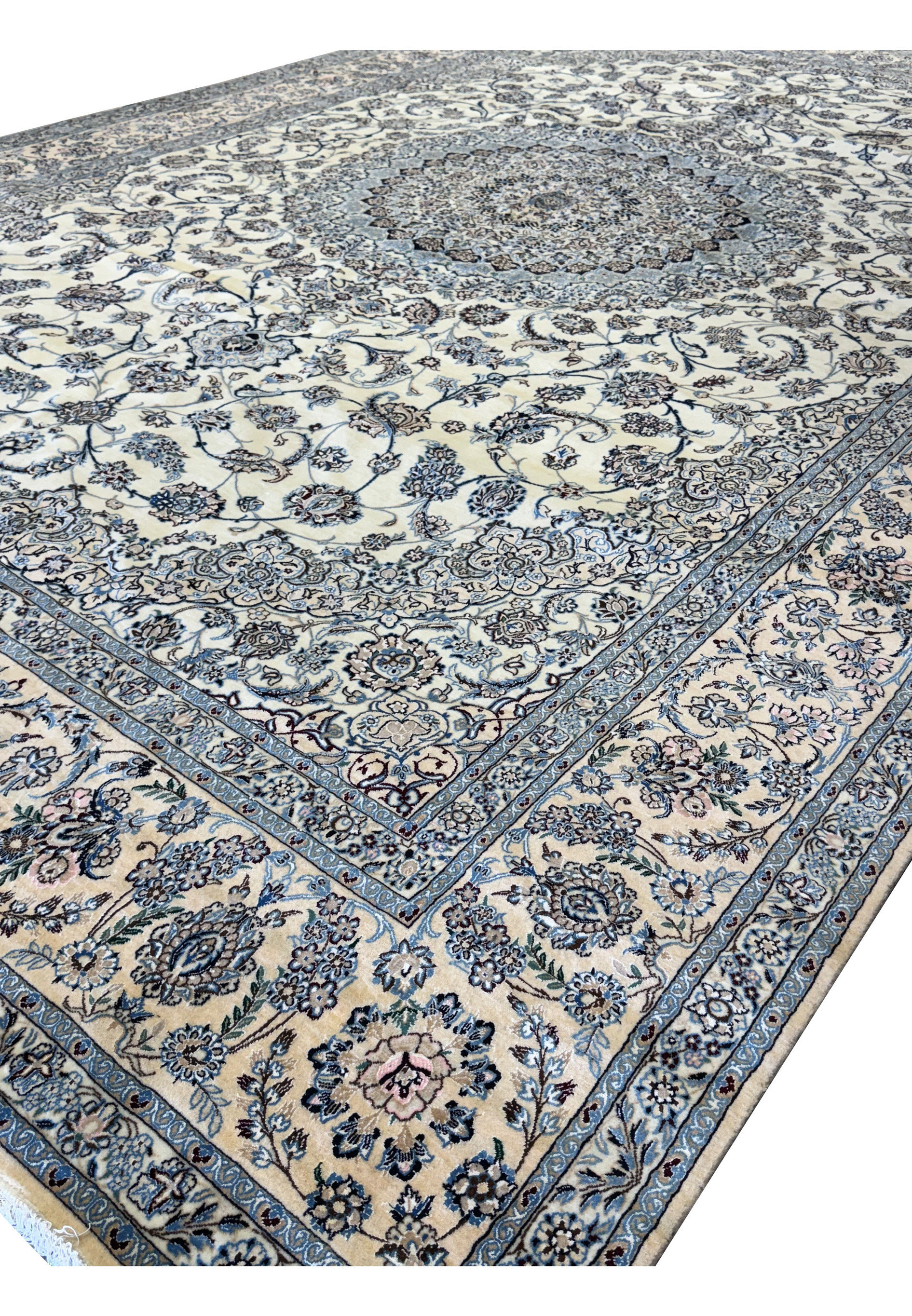 Side angle of the Persian Nain 9LAA Wool & Silk Rug displaying the field and border.