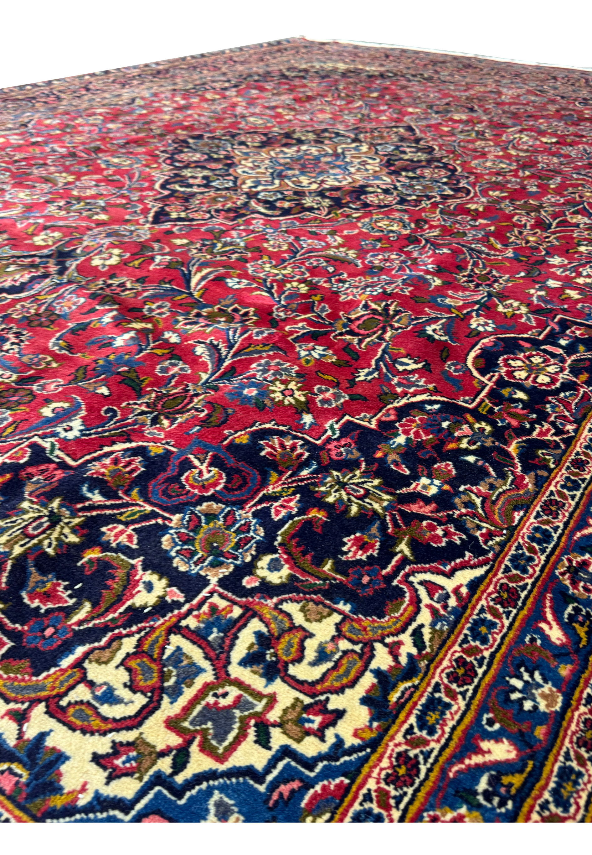 Close-up of the fringe and edge of a Persian Kashan Rug, showing high-quality cotton foundation and wool pile.