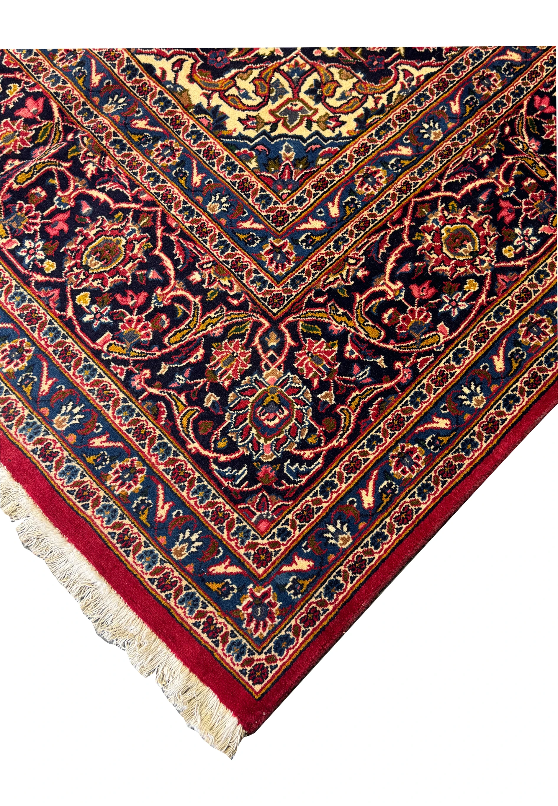 Close-up of the floral and vine motifs on a Persian Kashan Rug, emphasizing the intricate design and craftsmanship.