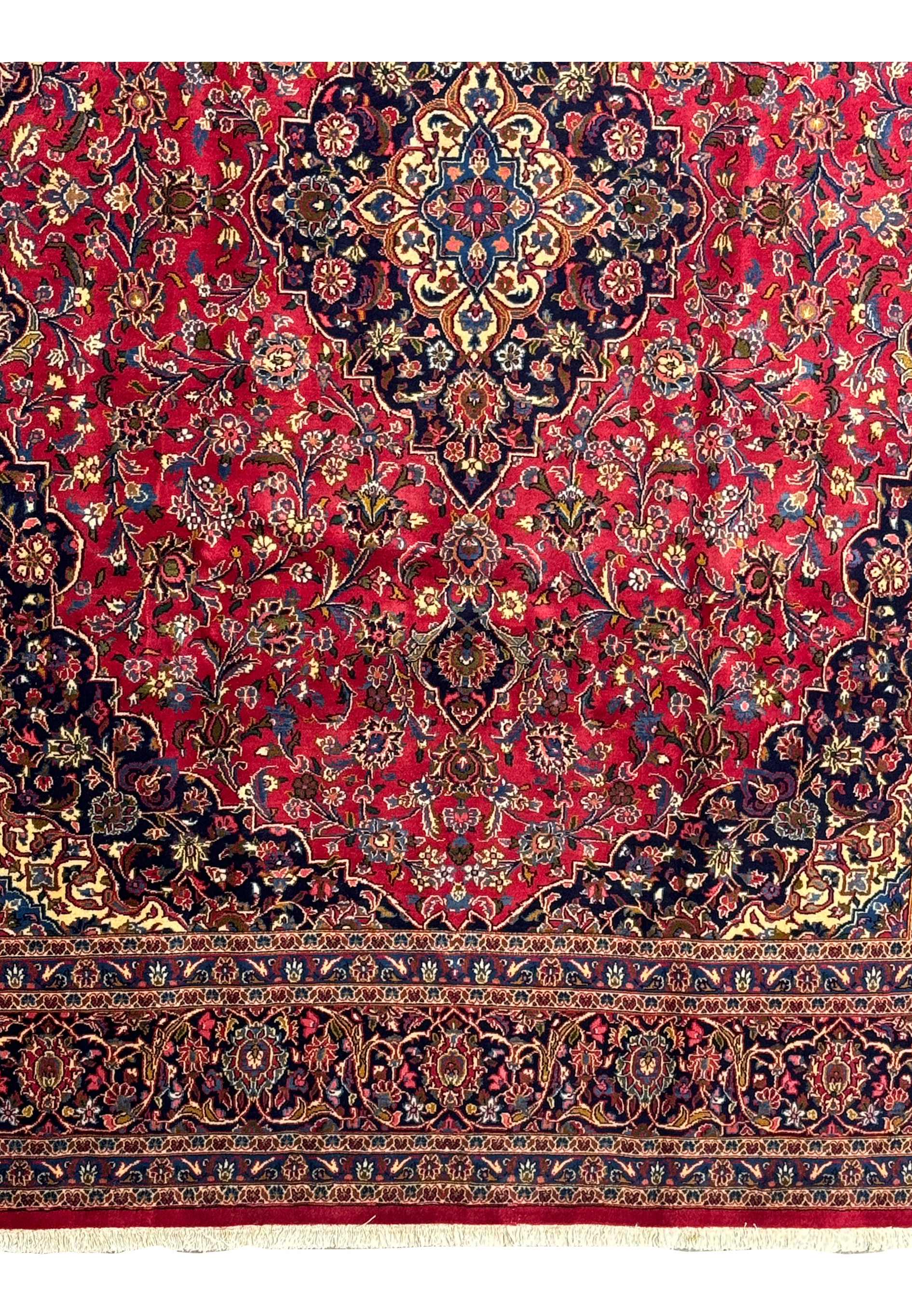 Detailed view of the border patterns on a Persian Kashan Rug, featuring floral and geometric designs.
