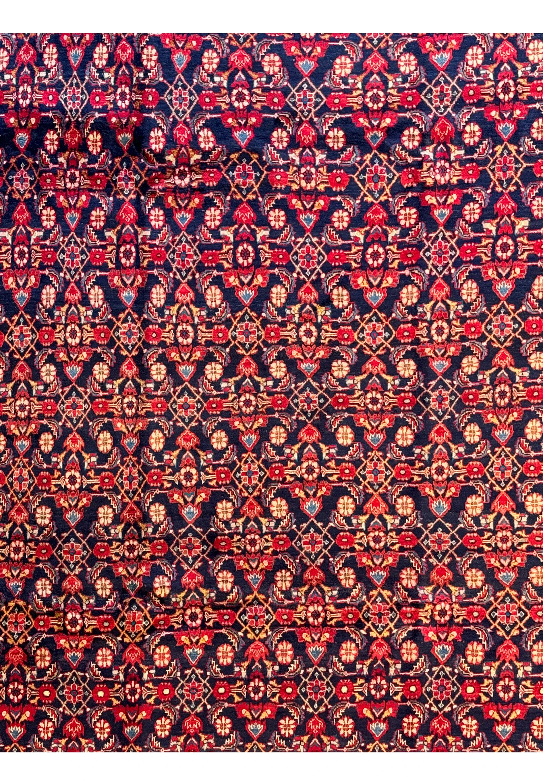 Close-up of the intricate floral and geometric patterns on a 9' x 12'5" Persian Mahal rug.