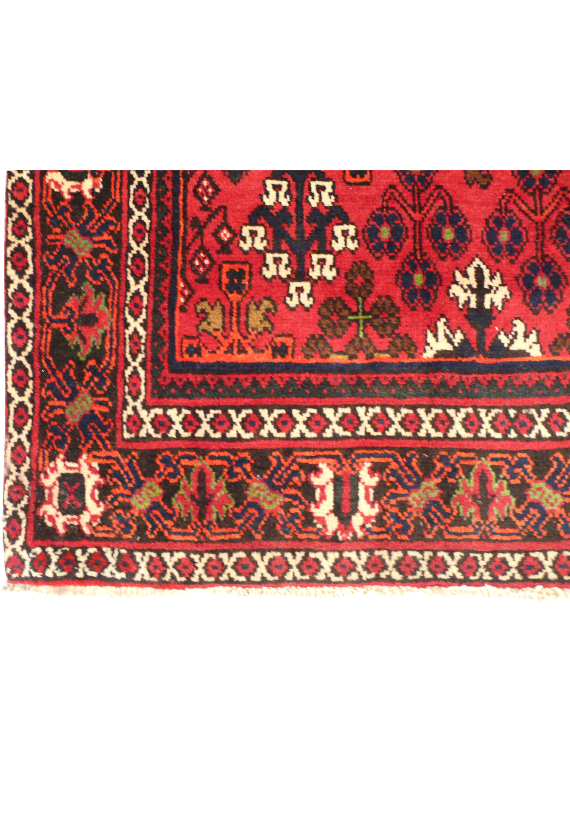A close-up view of the fringe and edge of the Persian Meymeh runner rug, illustrating the precise finishing details and craftsmanship. The intricate border patterns and rich colors are prominently displayed.