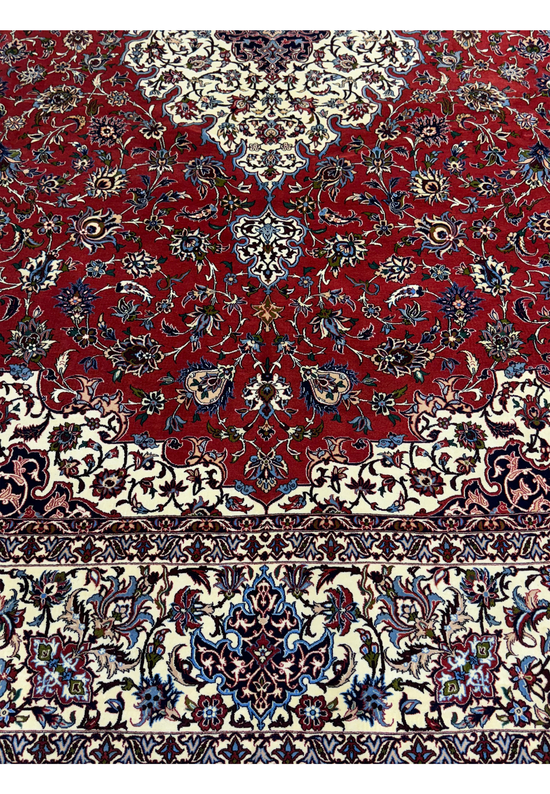 Detailed view of the red and ivory floral motifs in Persian Isfahan Silk Rug.