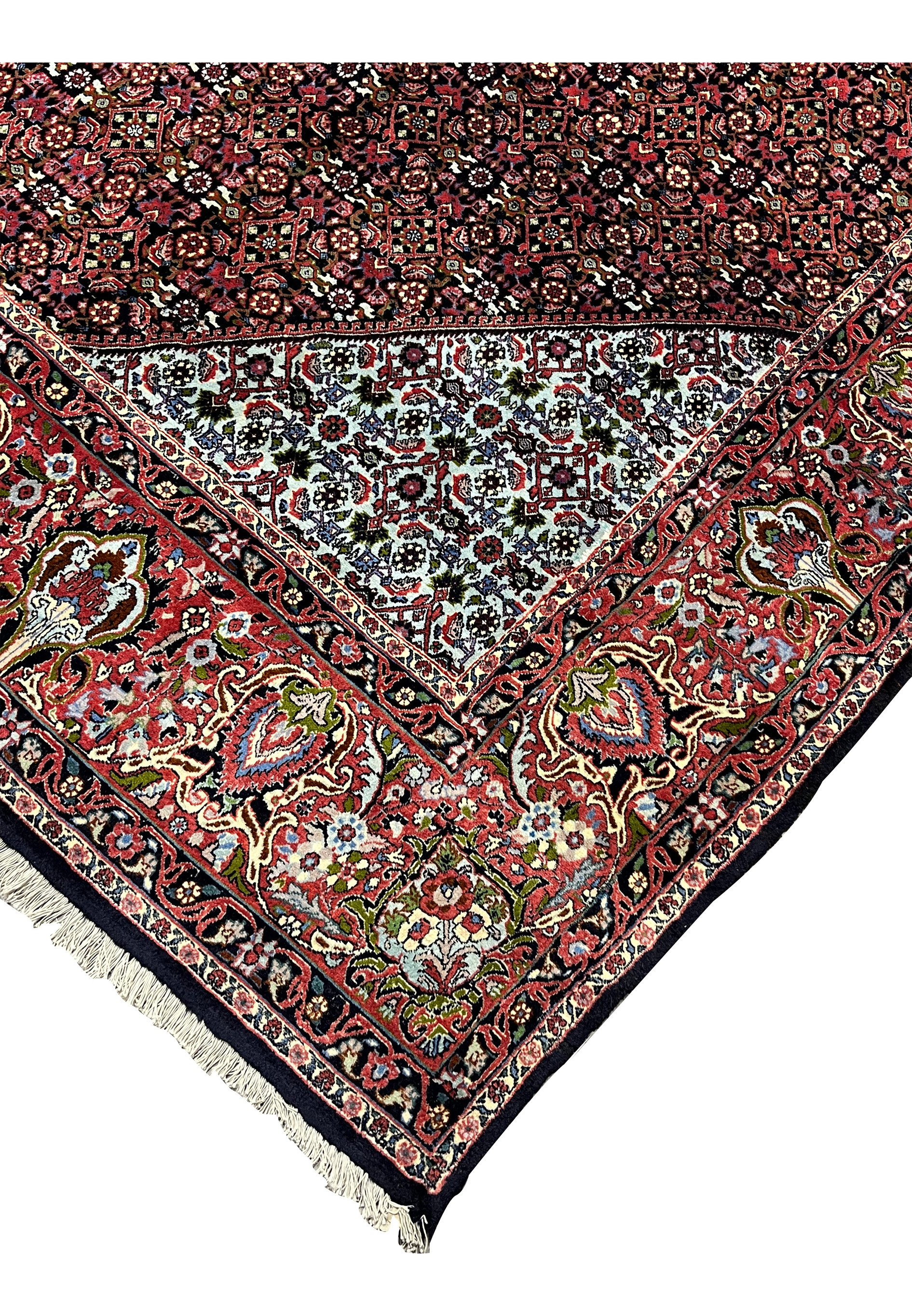 Edge detail of a Persian Bijar rug showing thick wool pile, reinforced selvage, dark navy edge finish, and strong construction known as the iron rug of Iran.