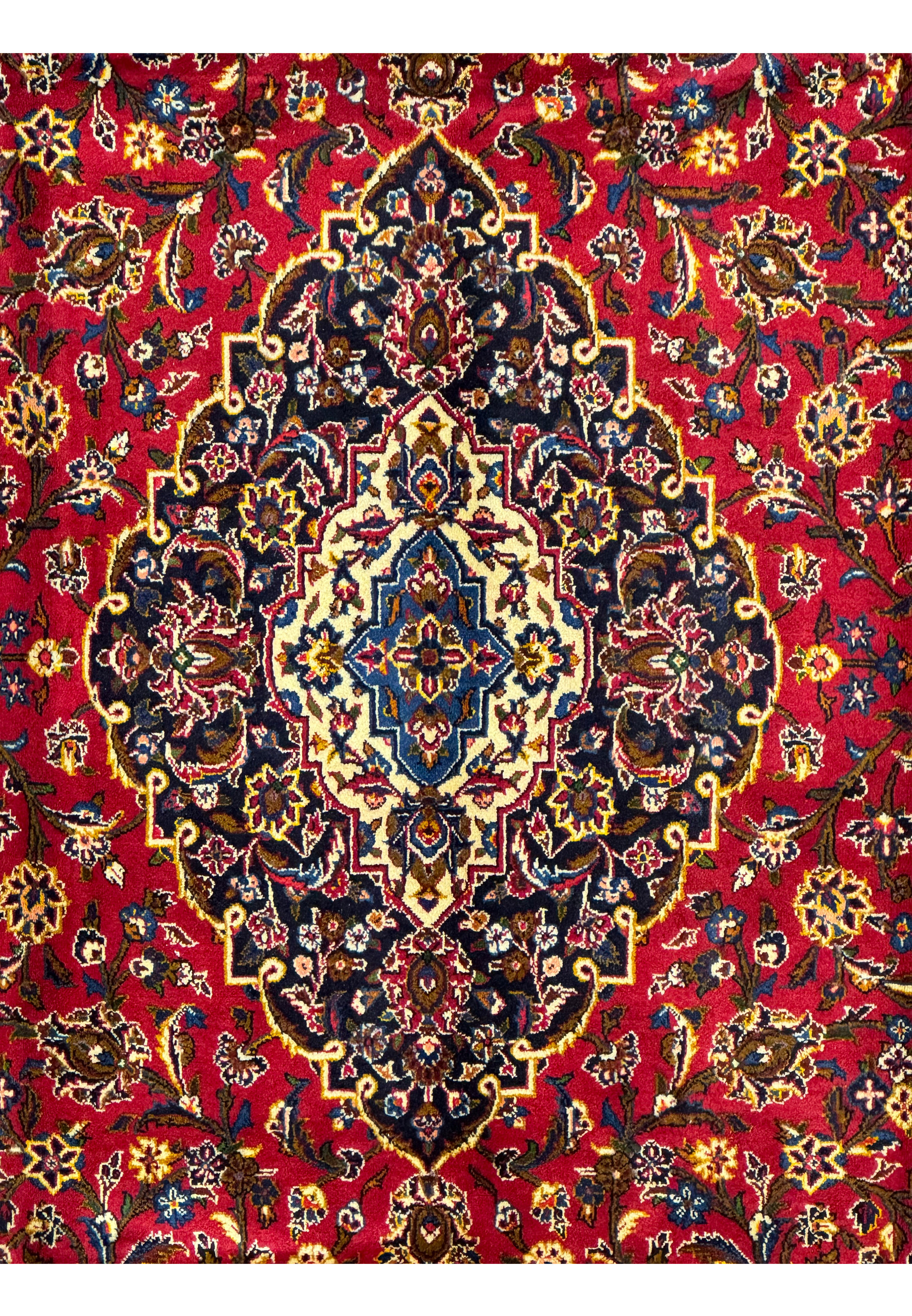 Close-up of the central medallion on the Persian Kashan Rug, showcasing intricate floral and geometric motifs.