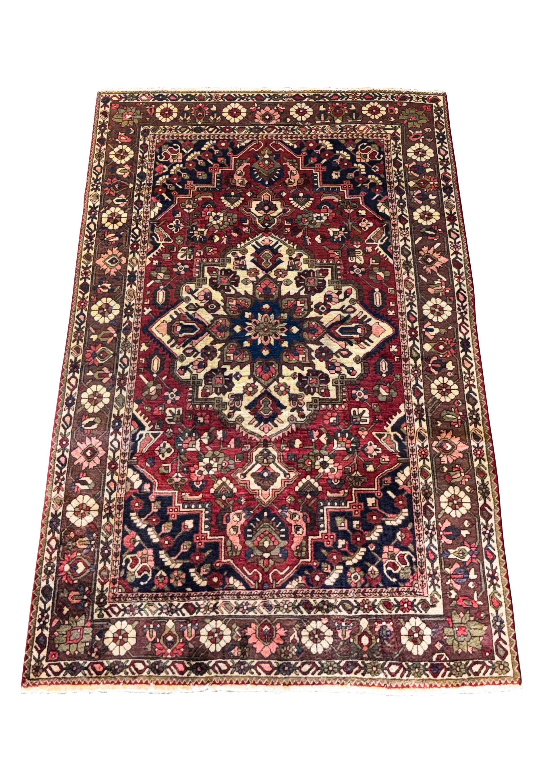 Angled view of the 6'6" x 10' Persian Bakhtiar rug showcasing intricate geometric and floral designs with vibrant colors and detailed patterns