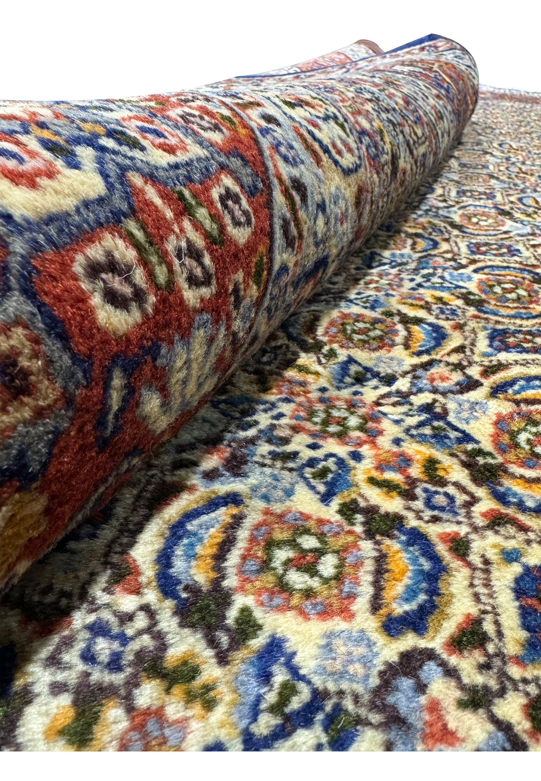 Rolled-up view of Persian Moud Rug showing the dense pile and intricate designs