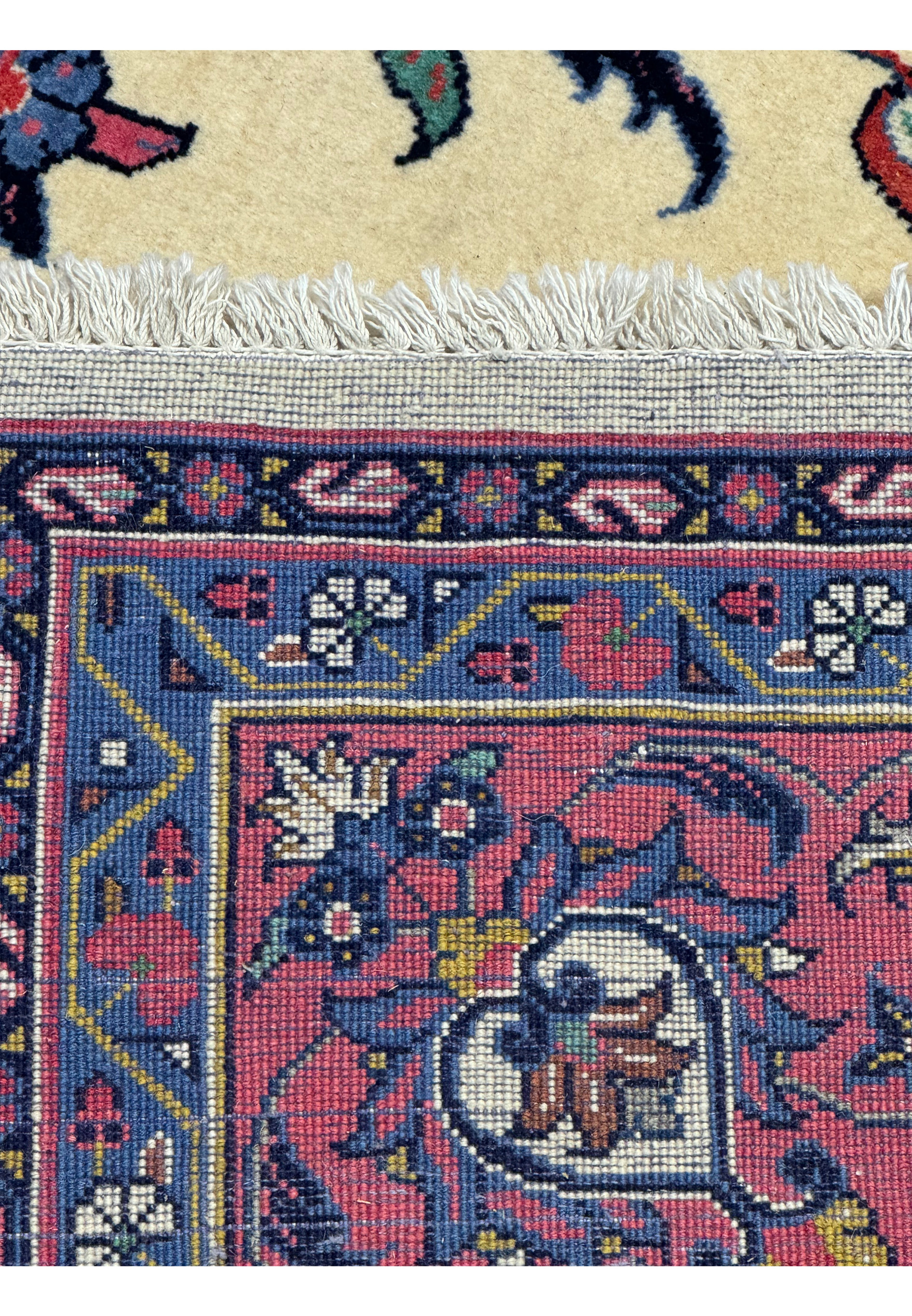 Zoomed into the back of the rug showing the very fine knots and high quality weave of this 7x7 Persian Square Rug