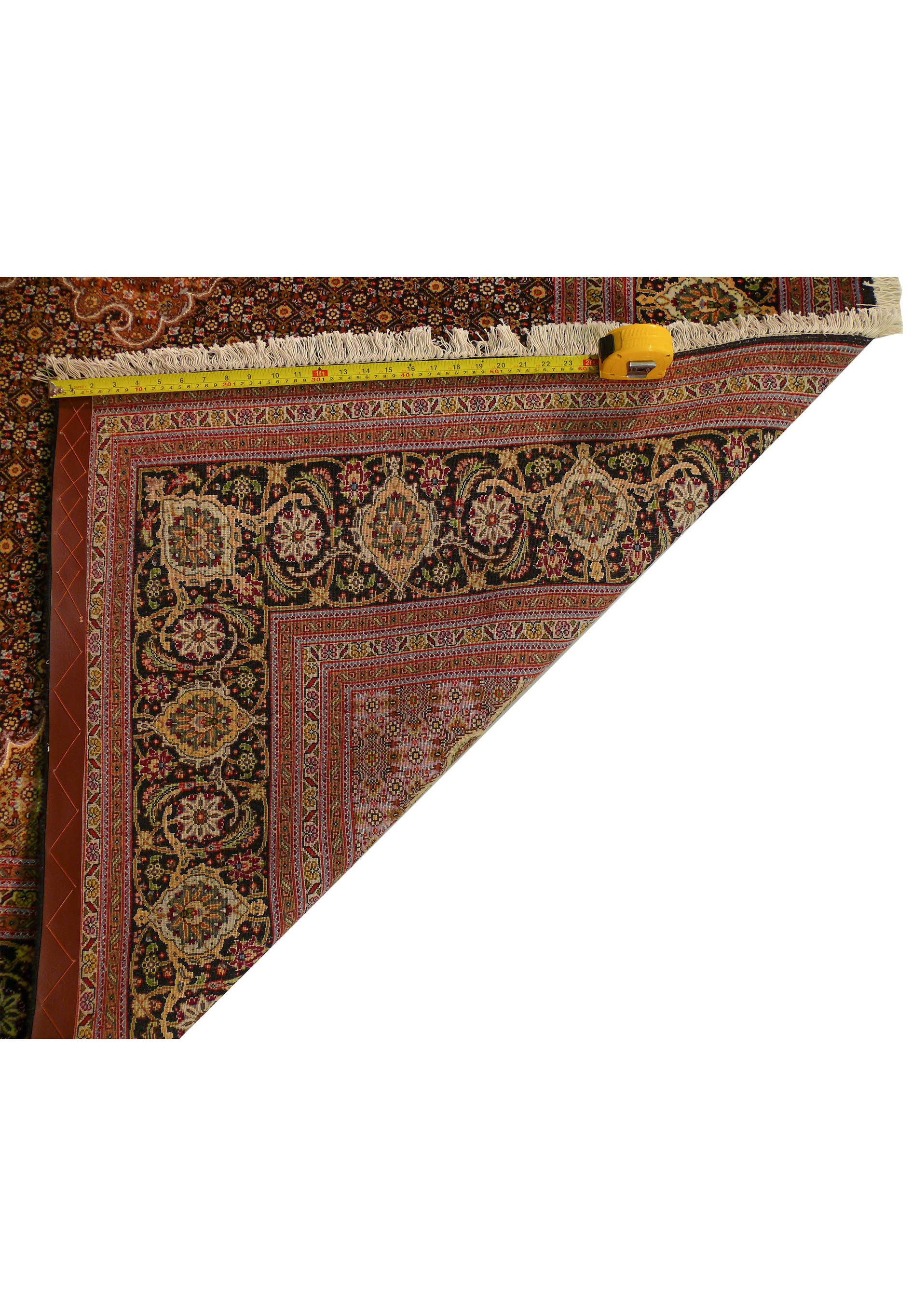 Measuring tape showing the density of the Tabriz Mahi 50 Raj Rug