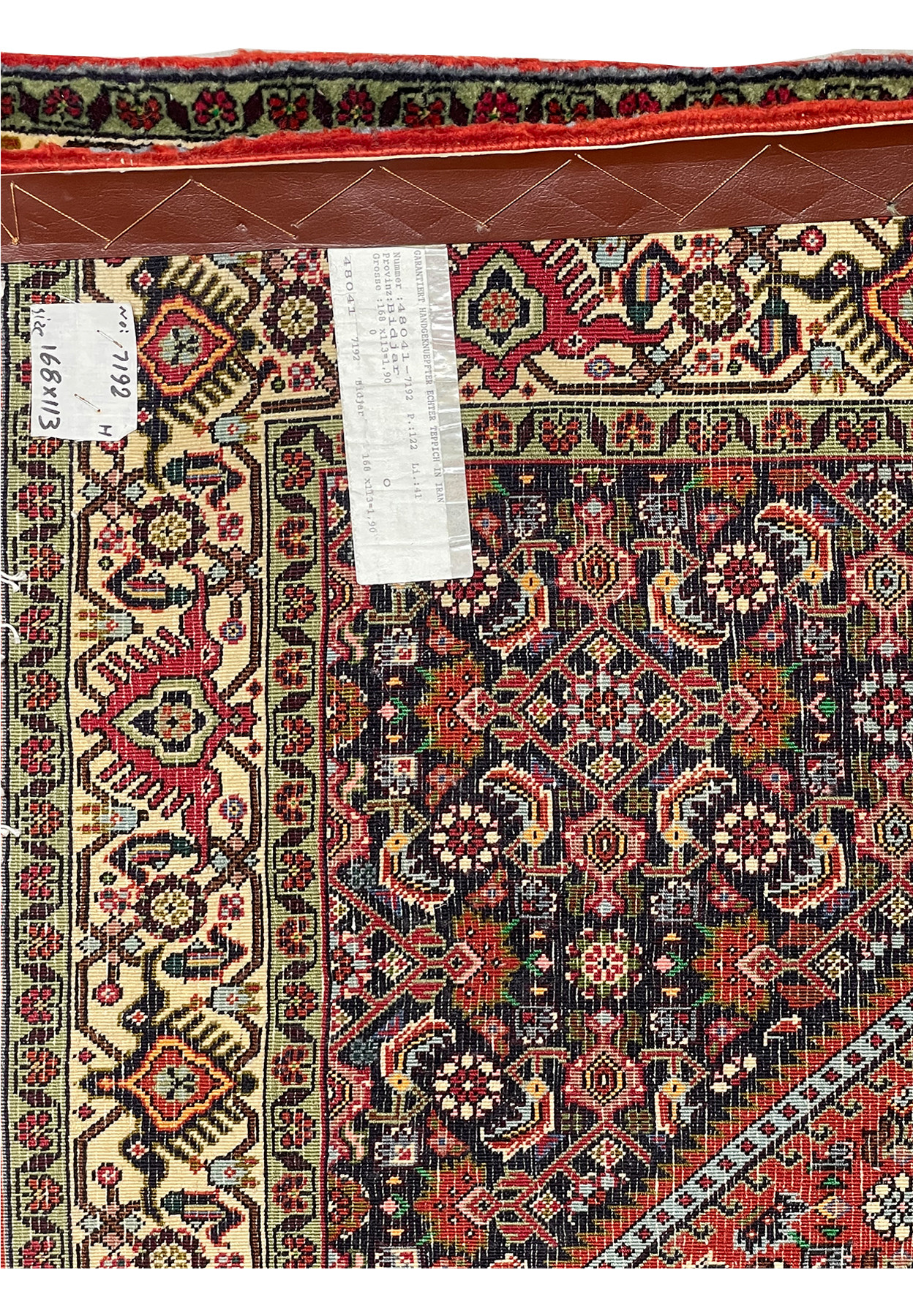 Back of Persian Bijar Rug showing knotting technique and authenticity tag.