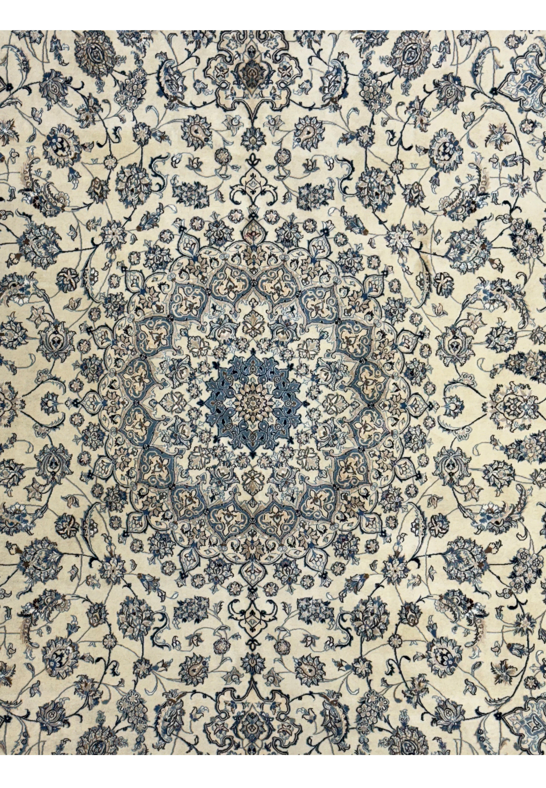 Detailed view of the central medallion design on a Persian Nain 9LA Wool & Silk Rug