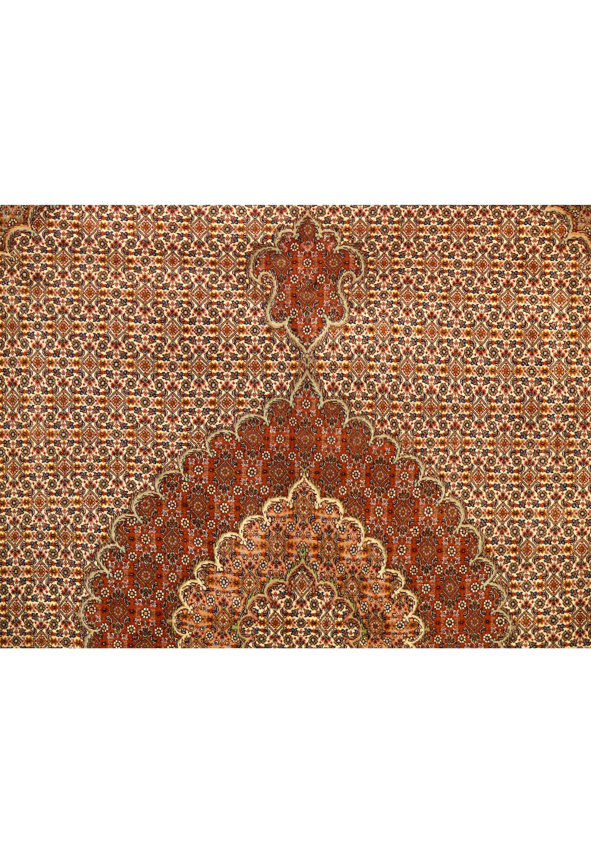 Pattern detail of the Tabriz Mahi Silk Rug showing the repeating motifs and vibrant colors.