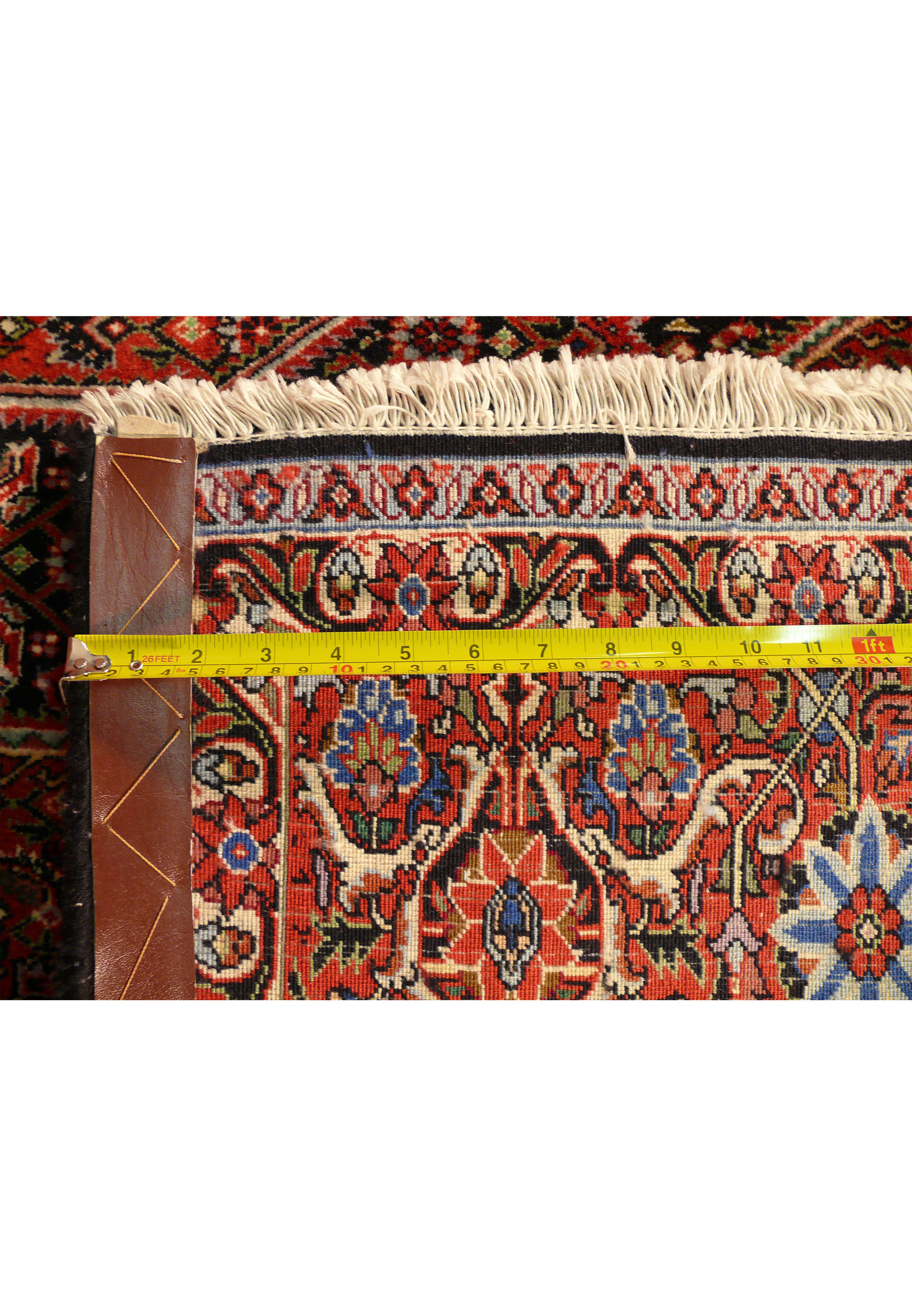 Zoomed into the back of this Bijar Persian Square rug with a ruler on it highlighting the high density of the knots.