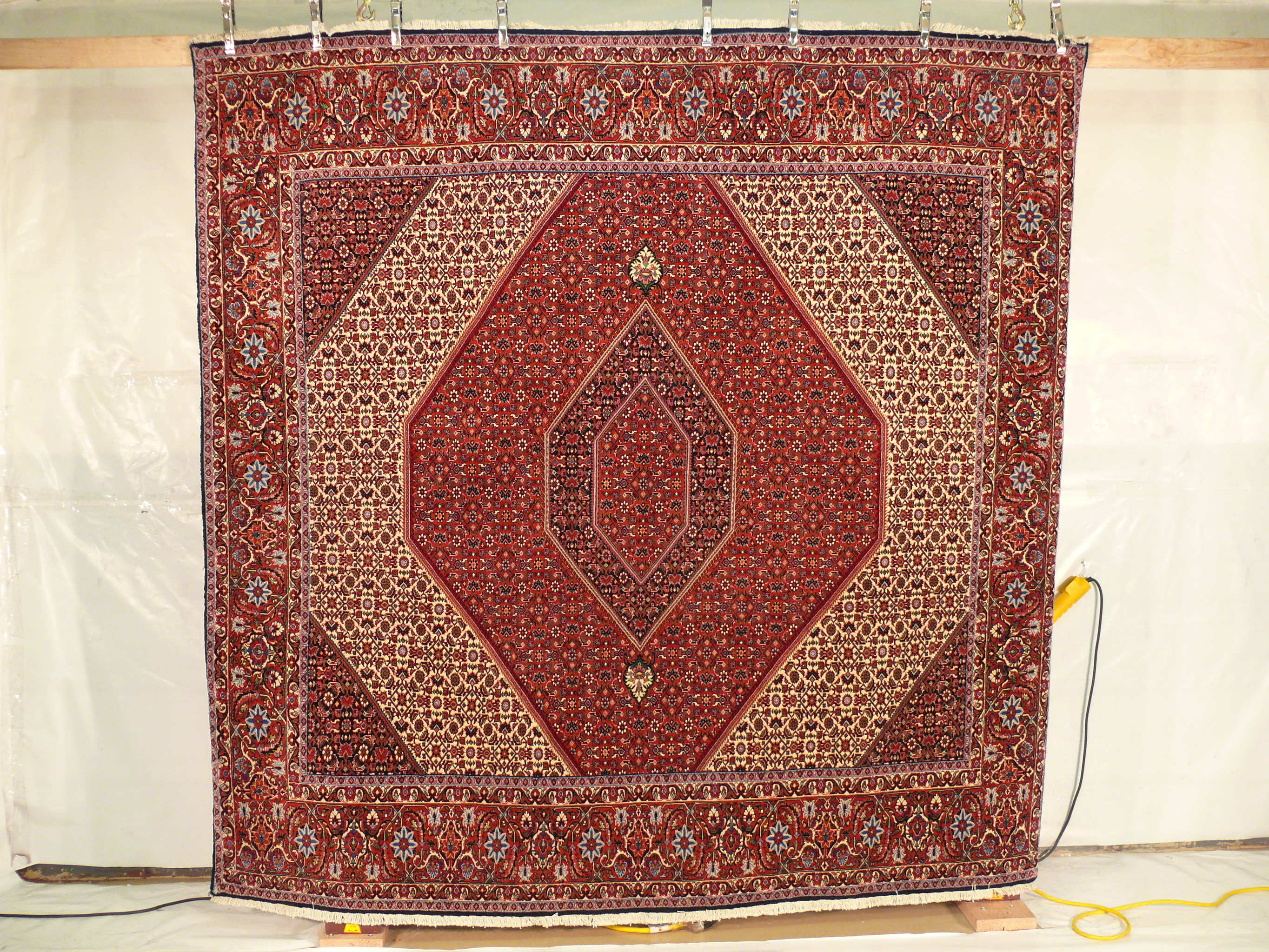 8'4" x 8'4" Bidjar Square Persian Rug hanging also known as iron rug of Persia.