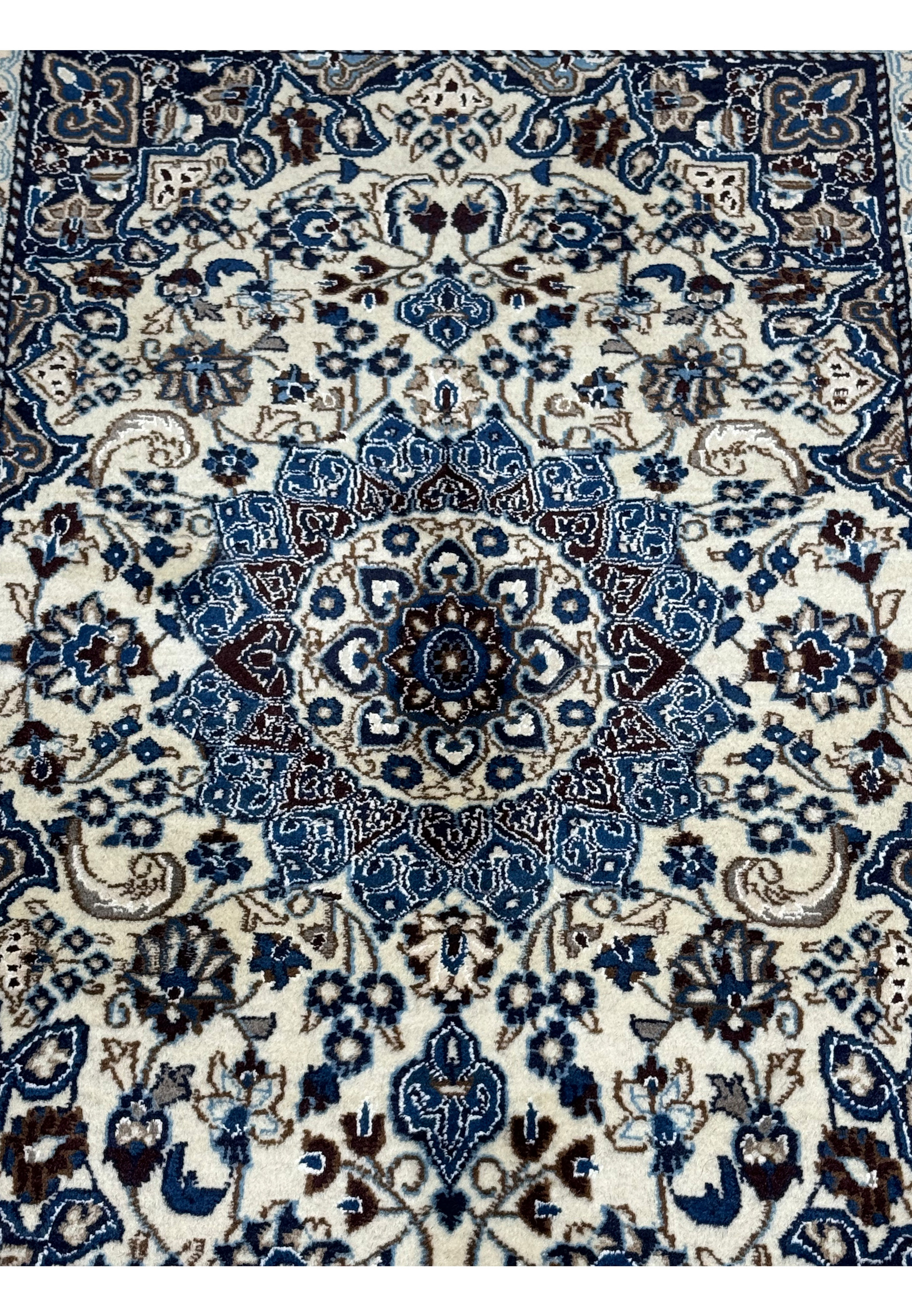 Close-up of medallion on 3 x 4'9 Nain Persian Rug highlighting craftsmanship.