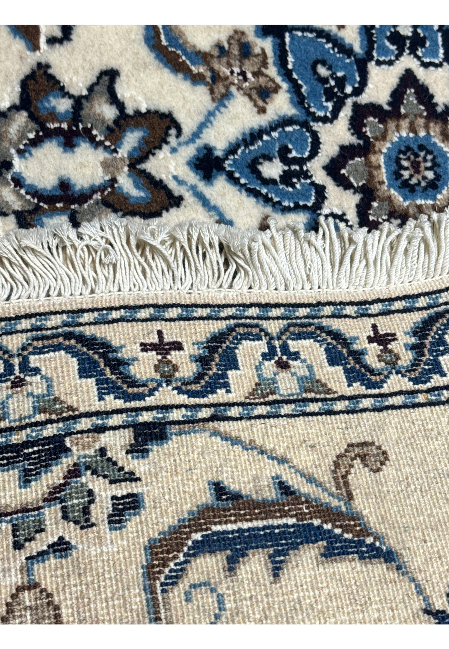 Back view of a Persian Nain Rug showing the fine weaving and high knot density.