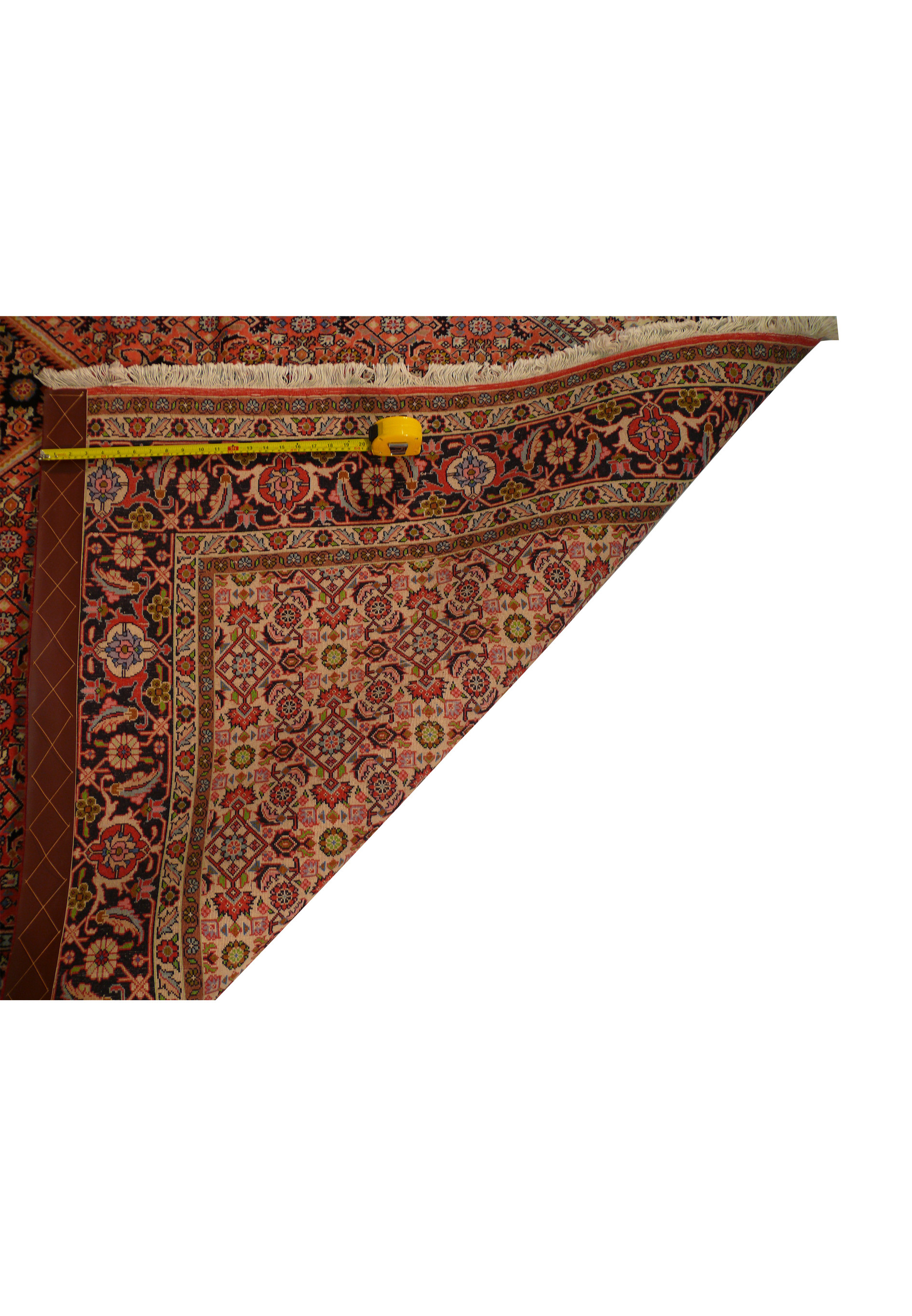 Detailed view of the 8'2 x 11'4 Persian Bijar Rug's backside, showing the fine weave and density with a measuring tape for accurate measurement.