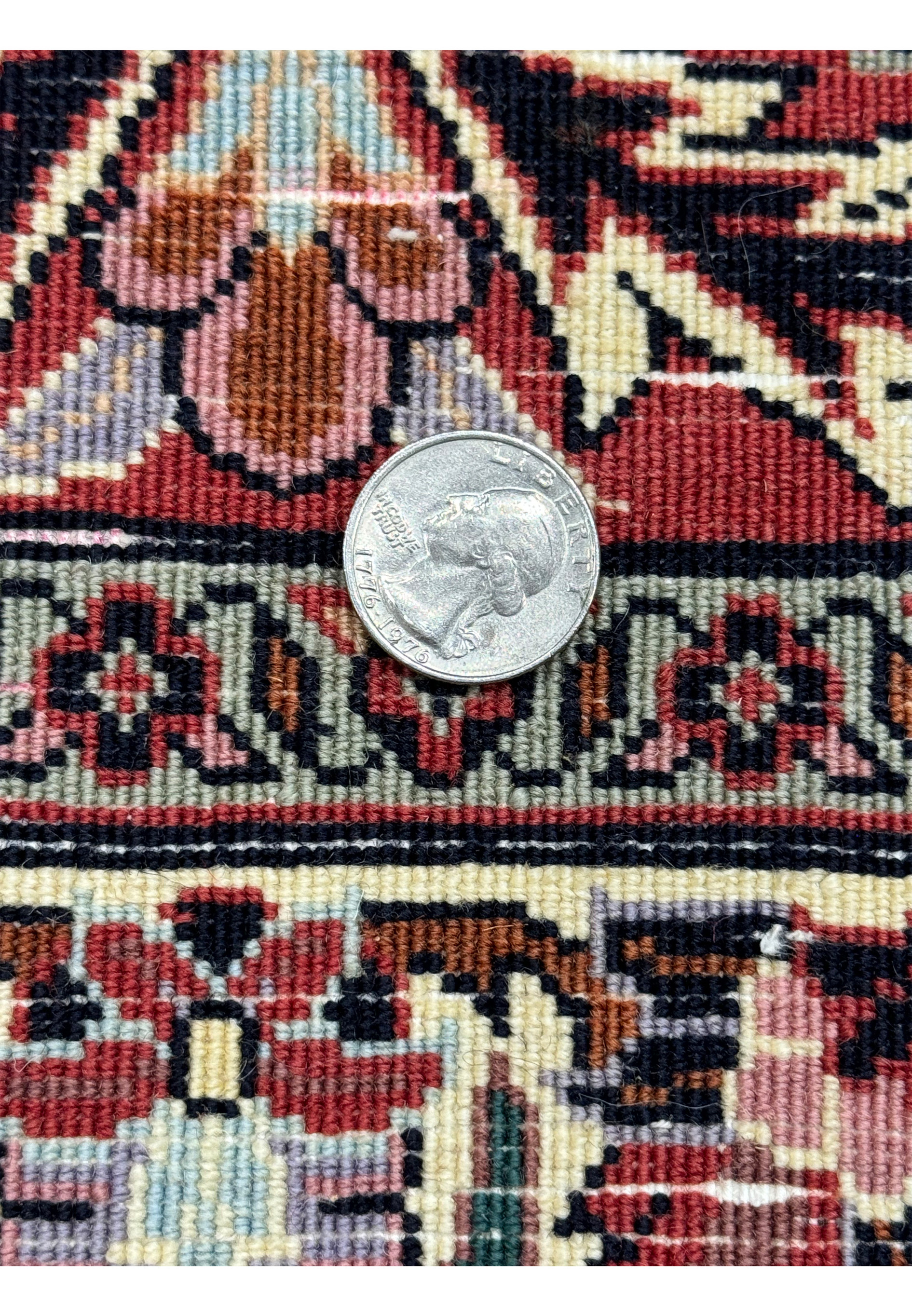Close-up of the 13x20 Persian Bijar Rug's weave density with a coin for scale.