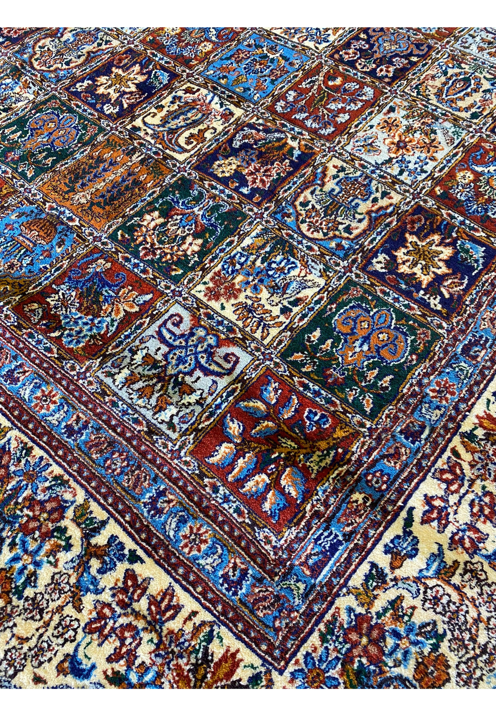Zoomed-in pattern on the Persian Moud Rug displaying the vibrant colors and intricate craftsmanship.