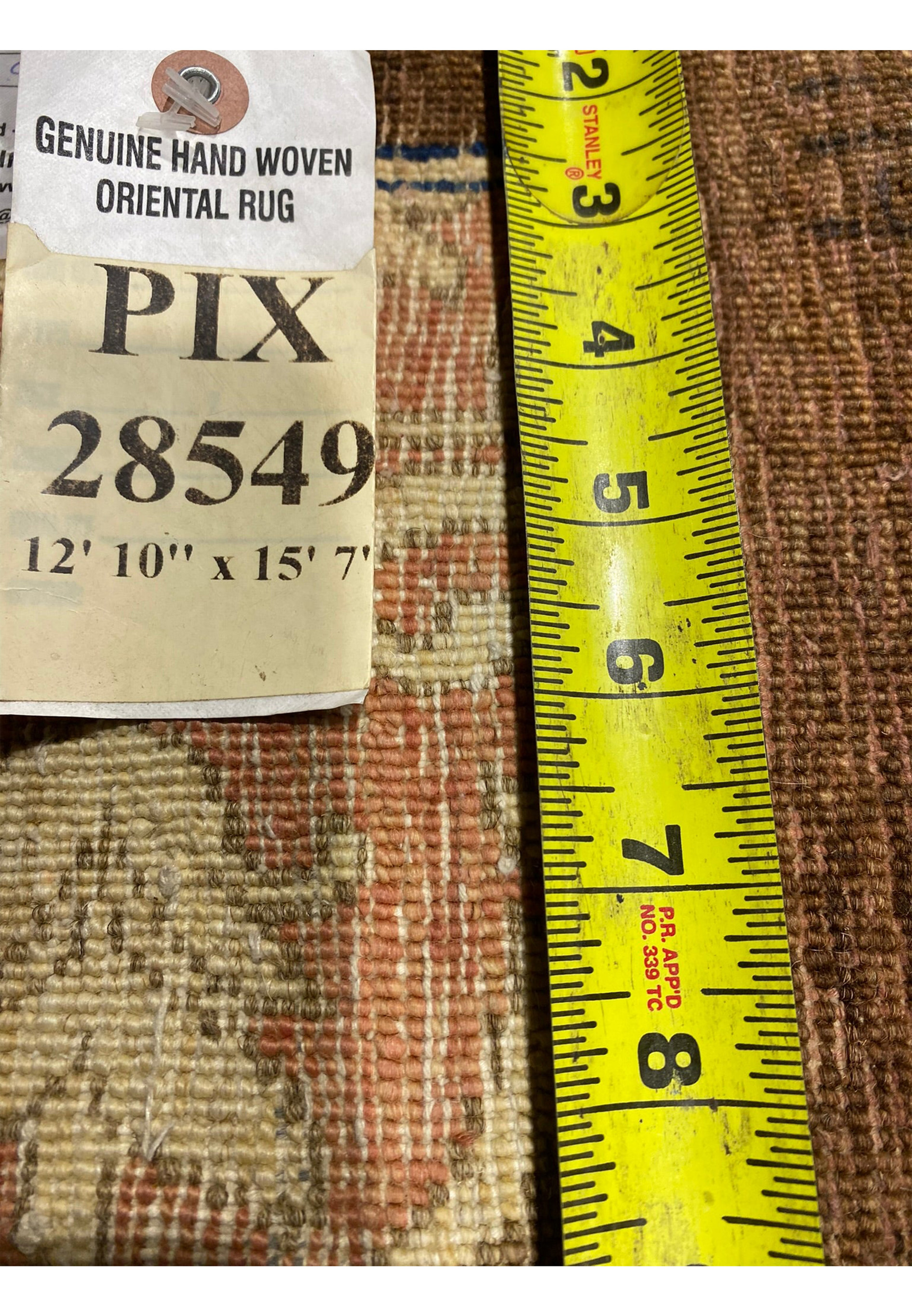 Close-up of 13x16 Ziglar rug tag with detailed size and weave information.