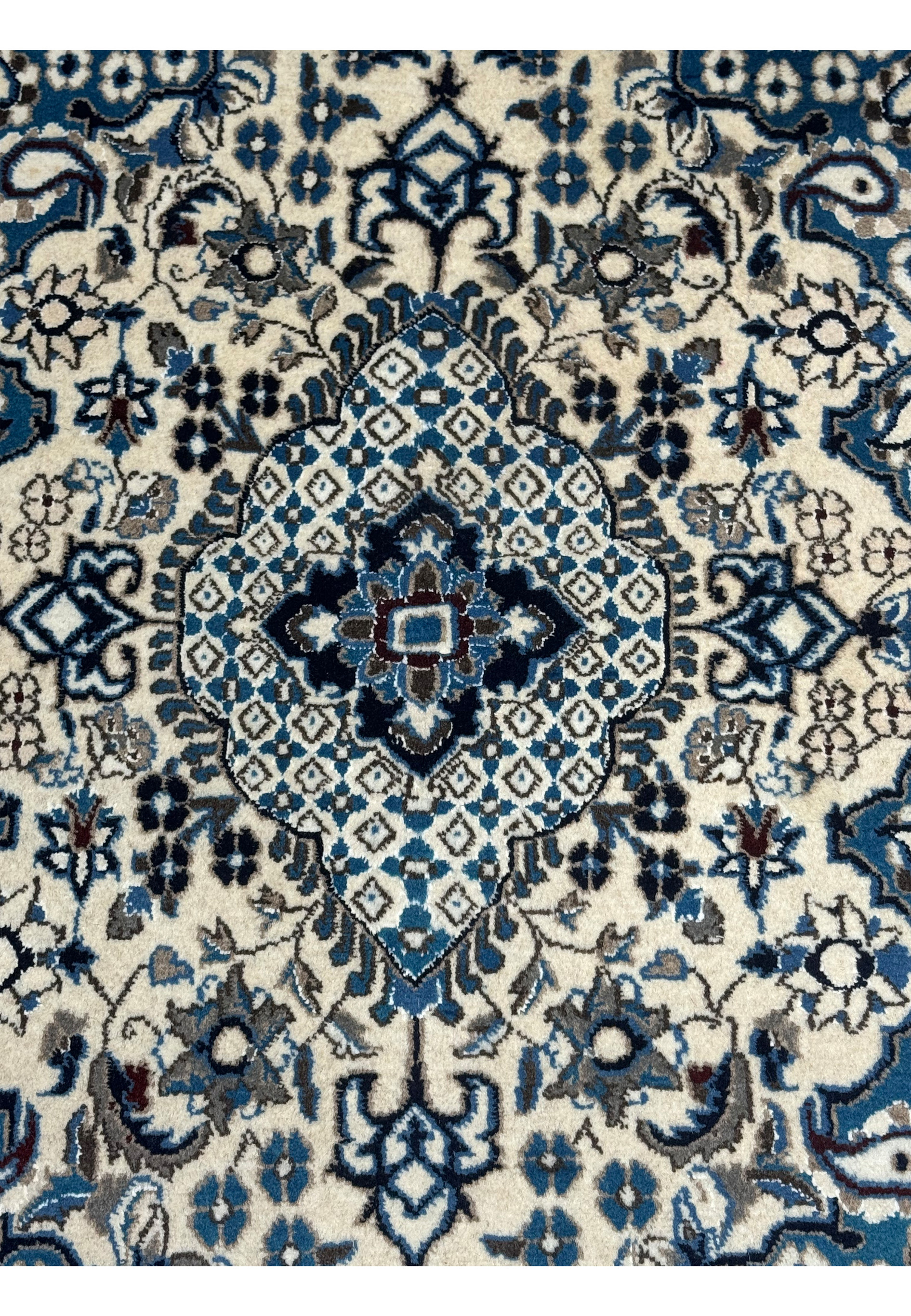 Close-up of the central medallion in the 2'9 x 4'7 Persian Nain Rug
