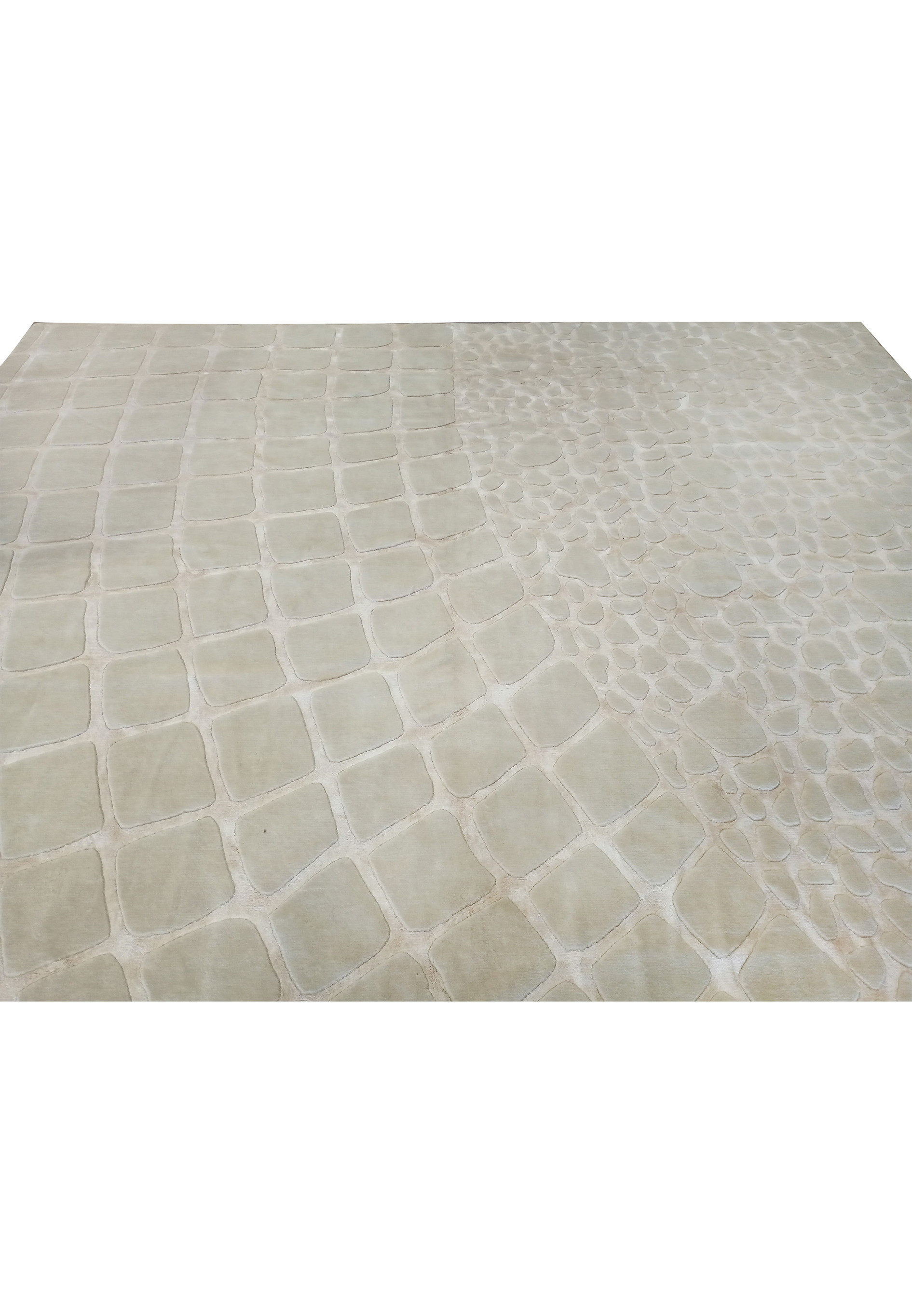 Texture detail of the off-white handmade wool rug with a modern design, showcasing the soft, plush feel and organic motifs