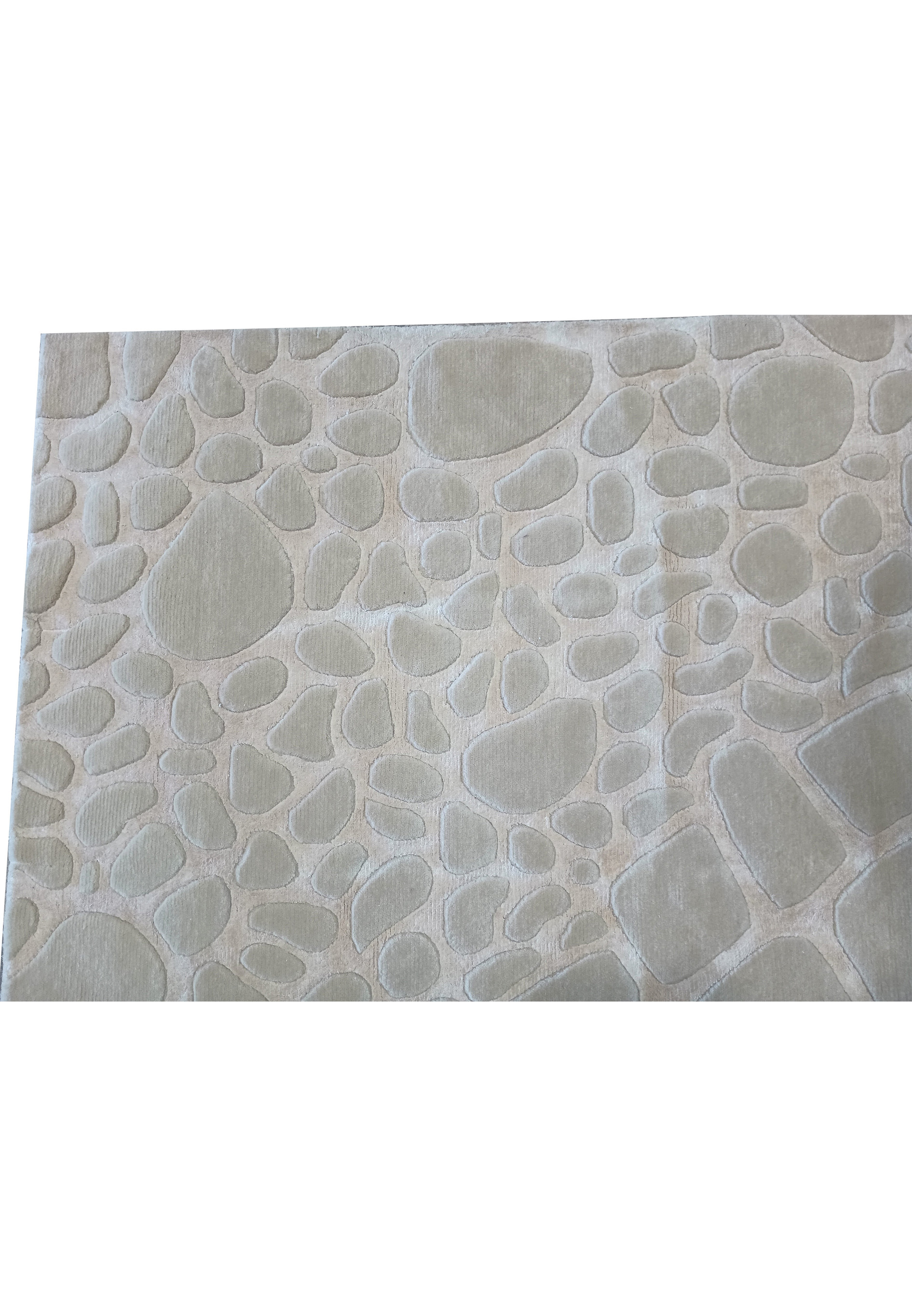 Detailed view of the pebble-inspired design on the 11' x 14' contemporary wool rug, highlighting the soft and subtle color palette