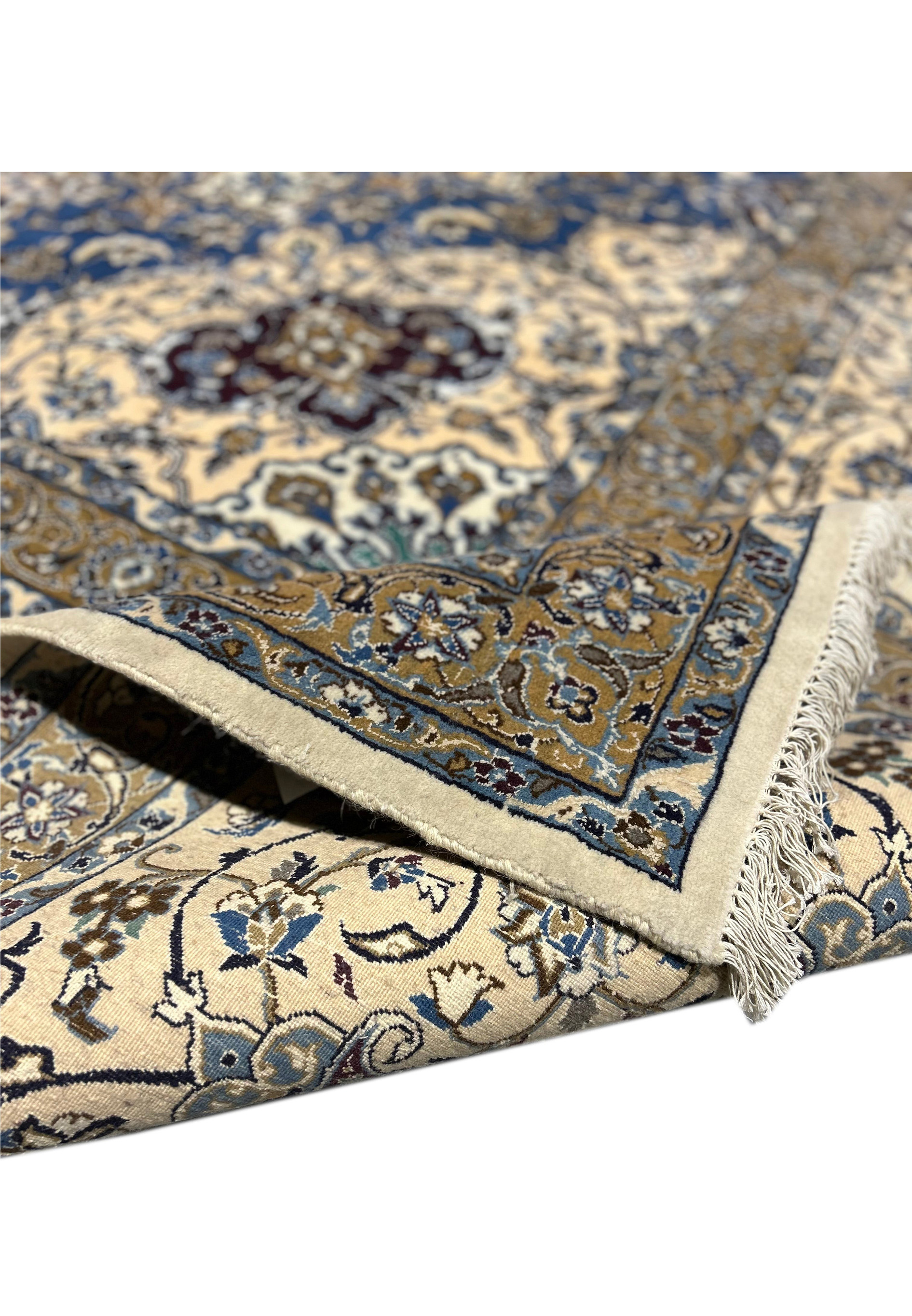 Backside of the 16' x 16' Persian Nain rug, showing the knotting and cotton foundation.