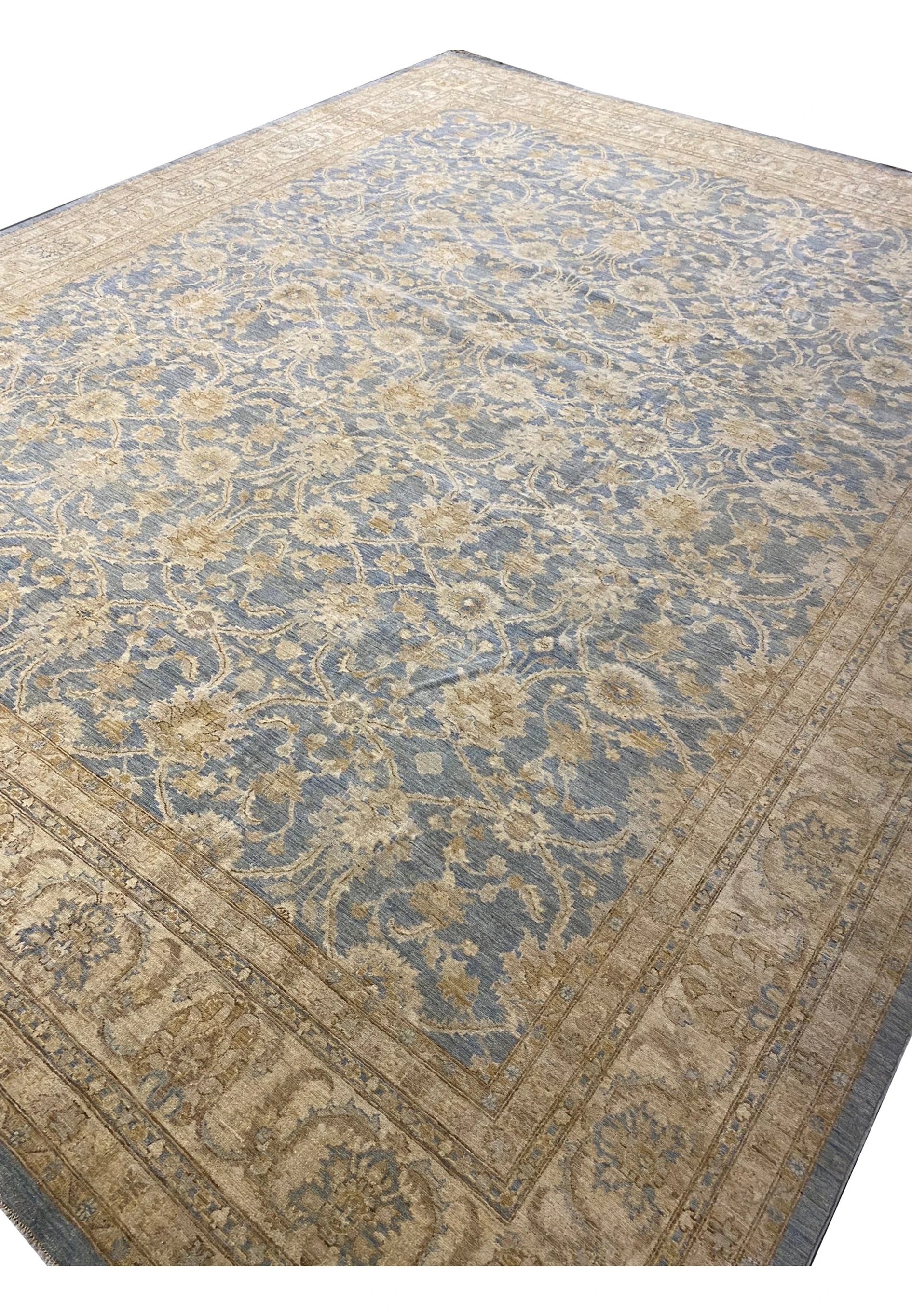 Angled view of the 15' x 19' Transitional Ziglar Rug on display.