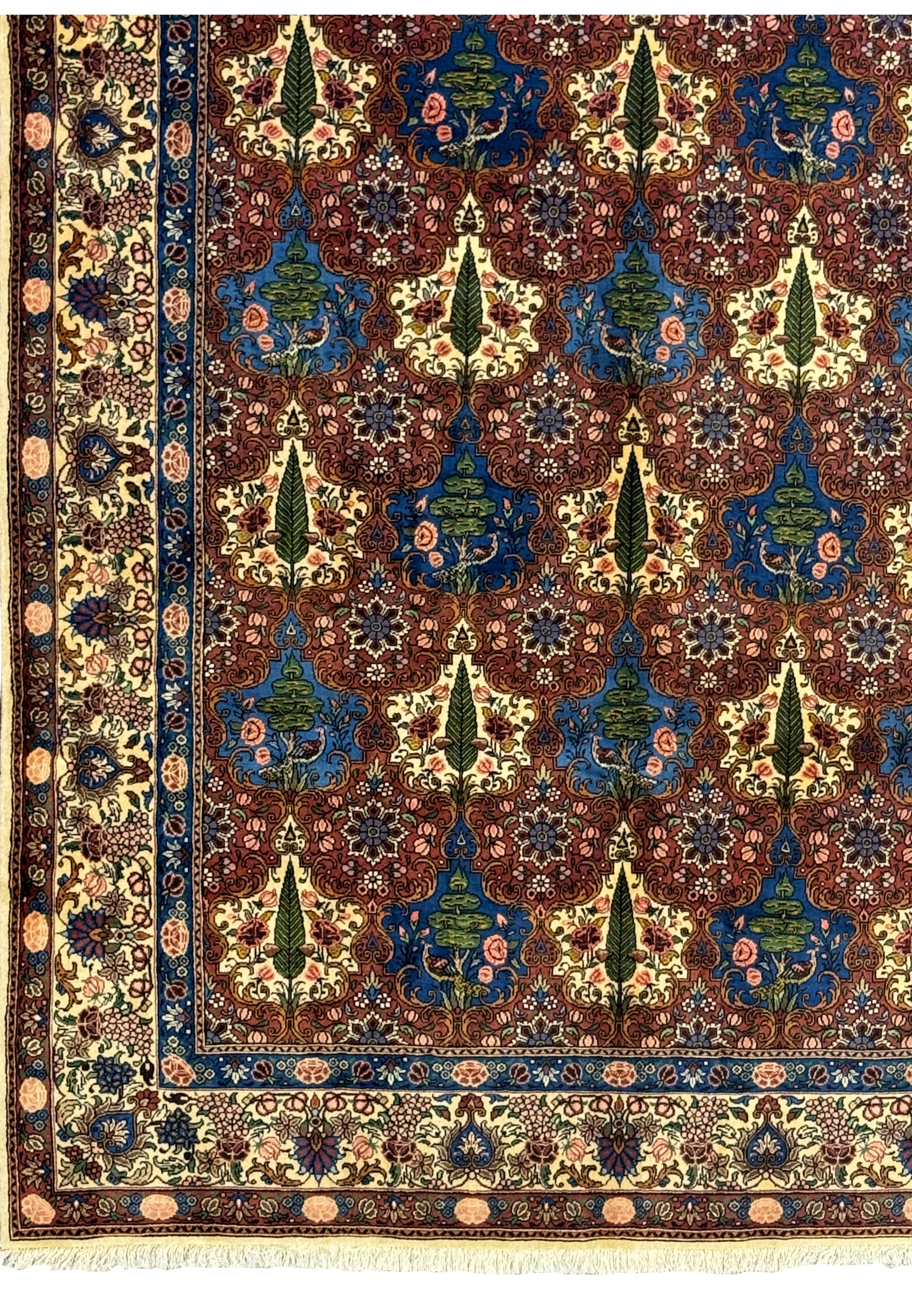Close-up of the detailed floral border on a Persian Bakhtiar Rug with vibrant leaf and vine patterns.