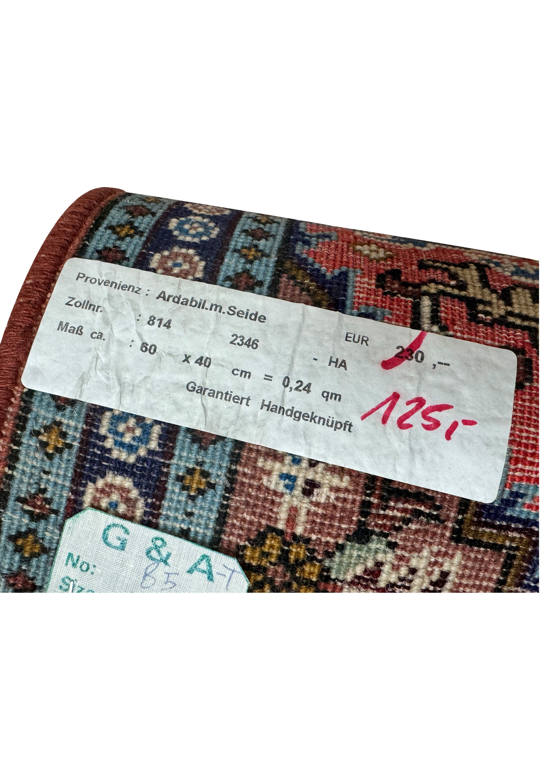 Tag on the 1'3 x 2 Persian Ardebil Wool & Silk Rug indicating origin and size.