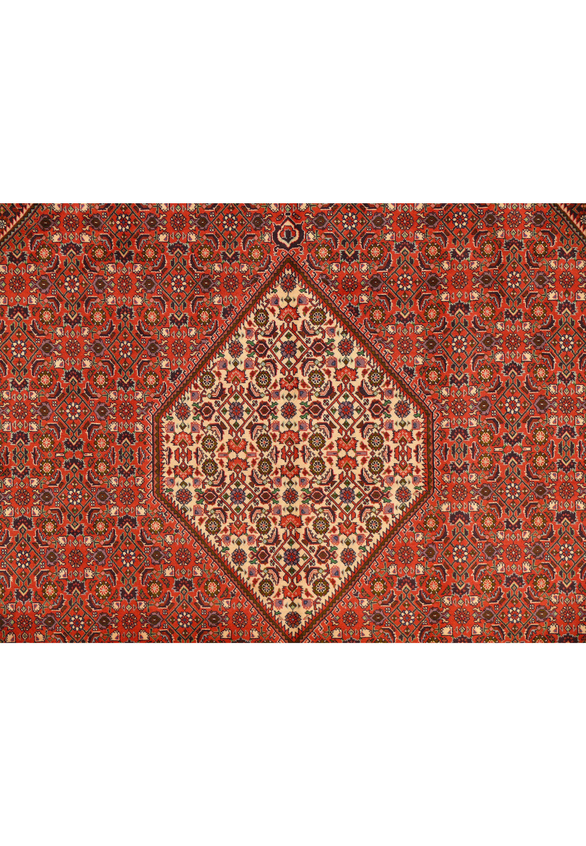 Close view of ivory diamond medallion and surrounding rust Herati field on 8'2 x 11'5 Bijar Persian rug.