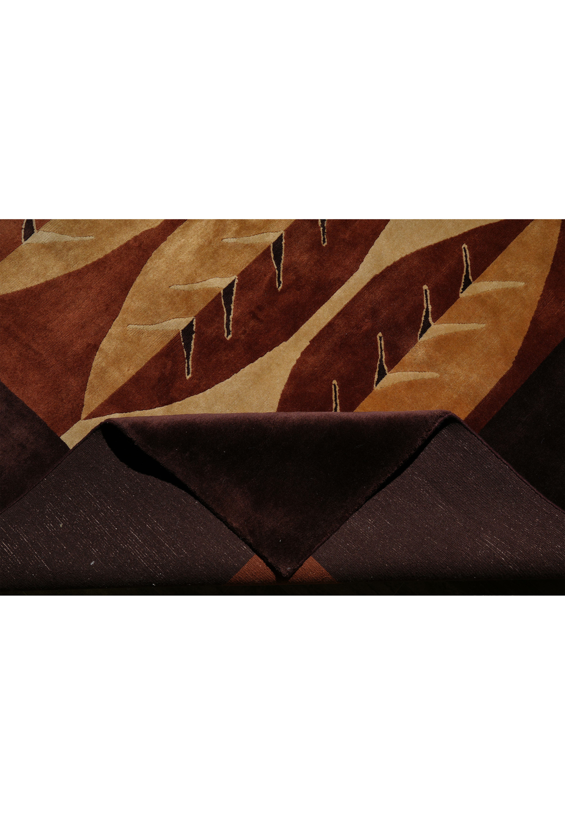 Edge view of 8x10 contemporary wool rug with chocolate brown border