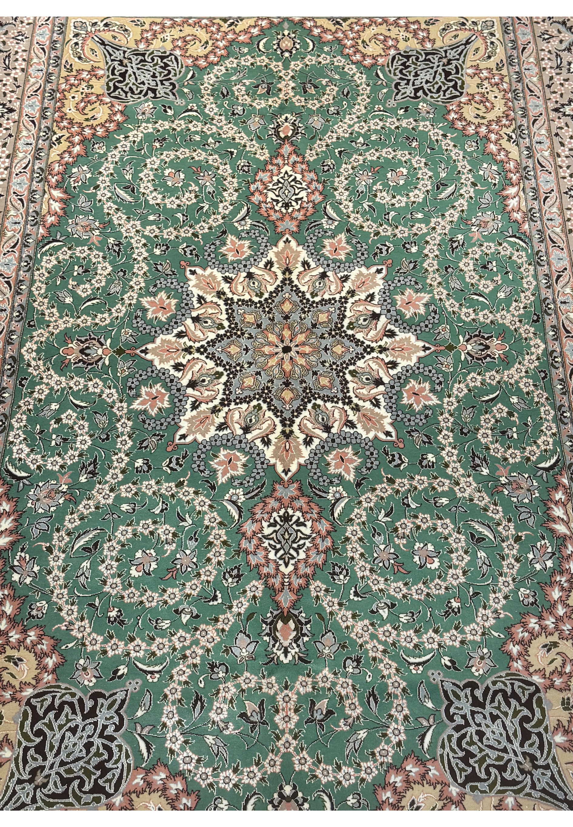 Central floral medallion of Persian Isfahan rug with silk highlights