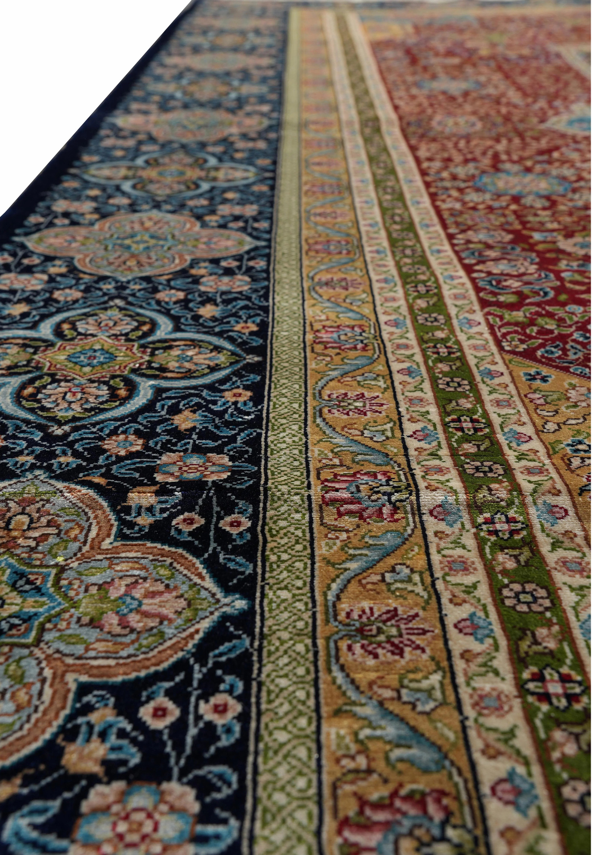 Ornate floral border detail of 6x9 vintage oriental silk rug, signed Kurosh."