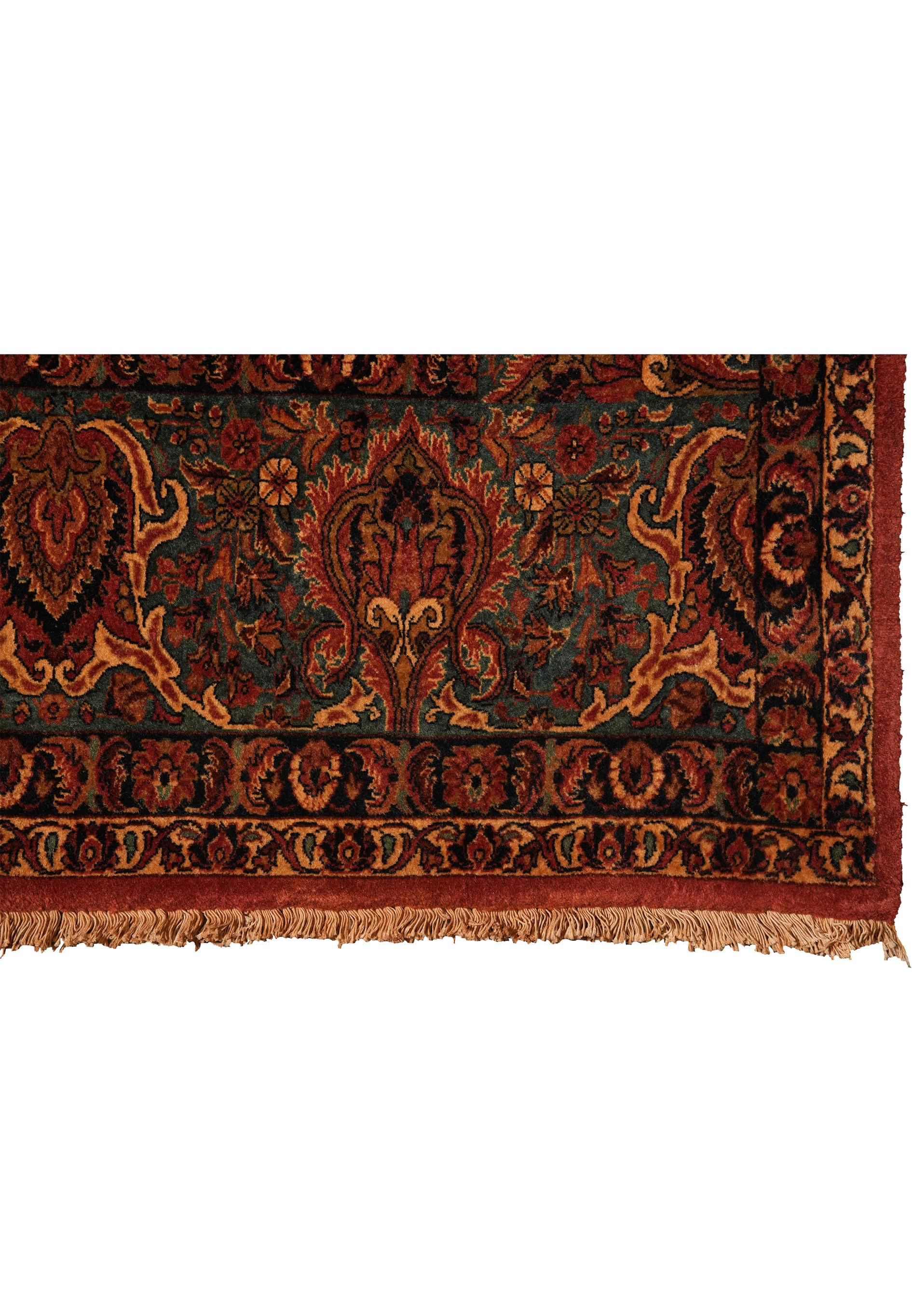 Close-up of green main border with palmettes and scrolling floral motifs