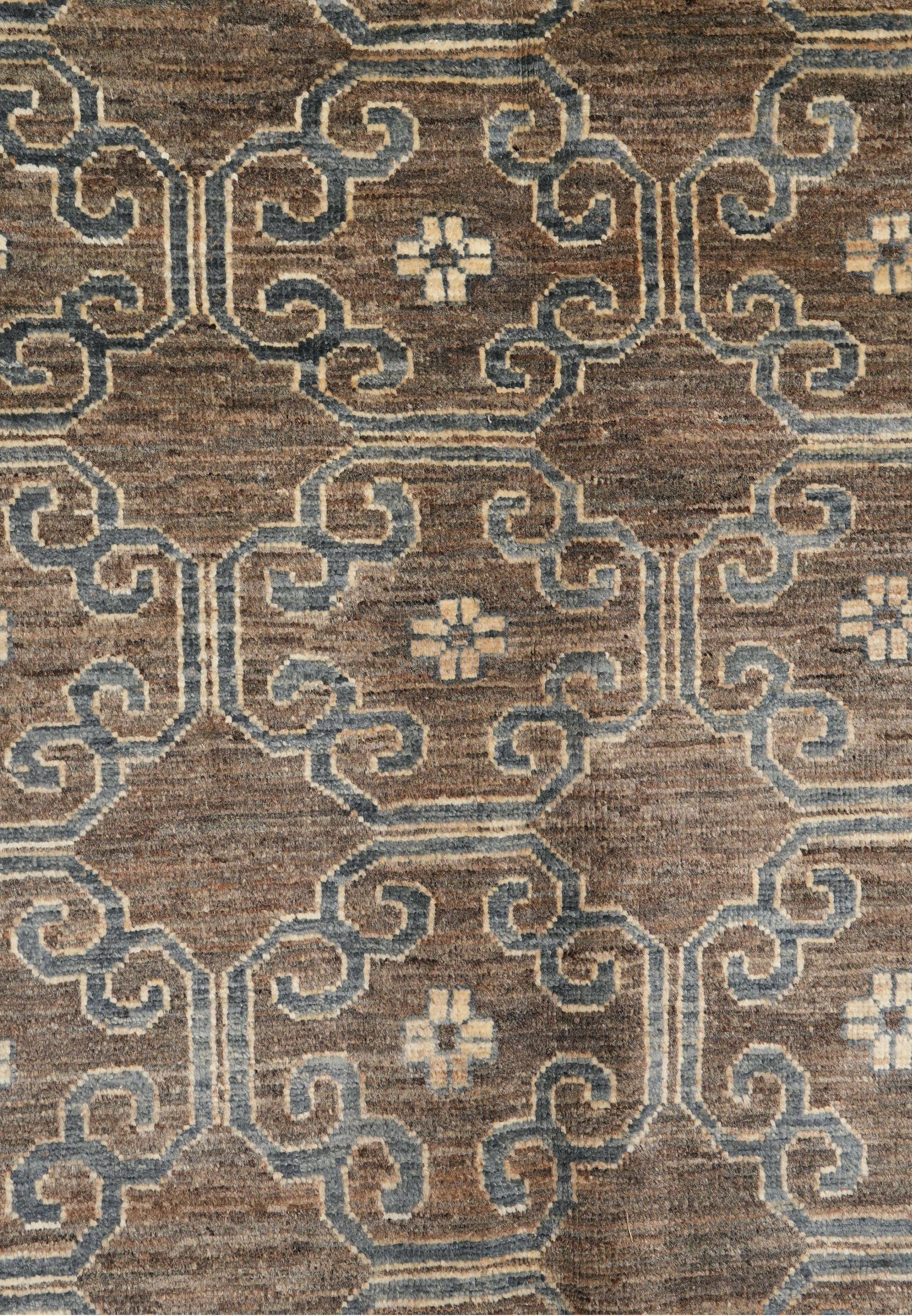 Zigler Transitional Rug close-up showing geometric lattice design in smoky grey, brown, and beige with wool texture.