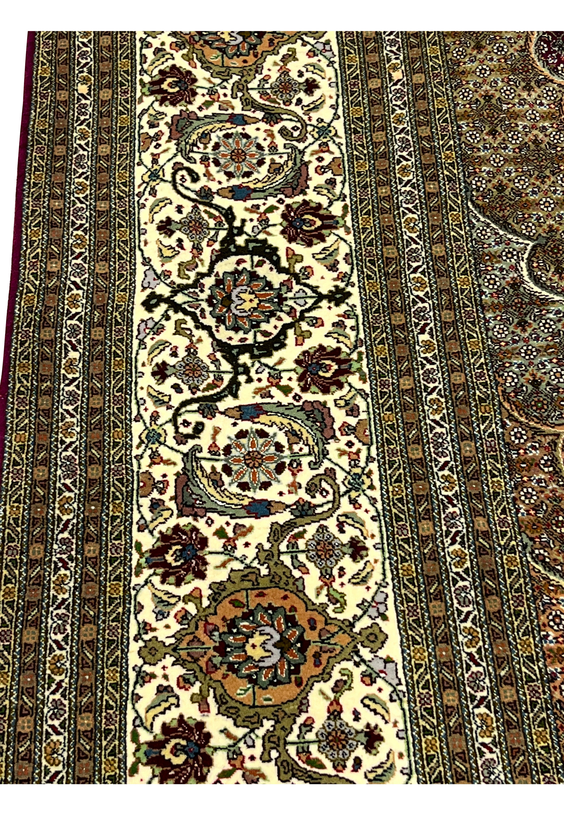 Close-up of Persian Tabriz 50 Raj Square Rug ivory border with intricate floral motifs and fine detailed weaving