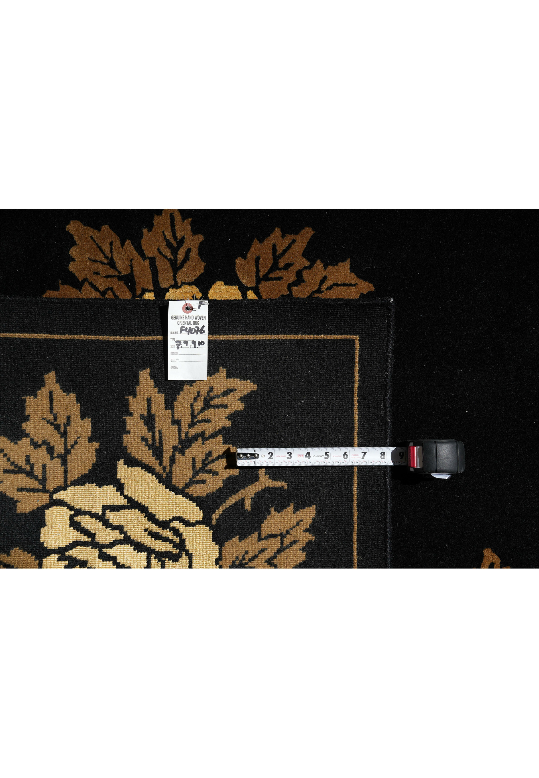 Backside of 7'9 x 10 handmade modern floral wool rug showing fine weave and label