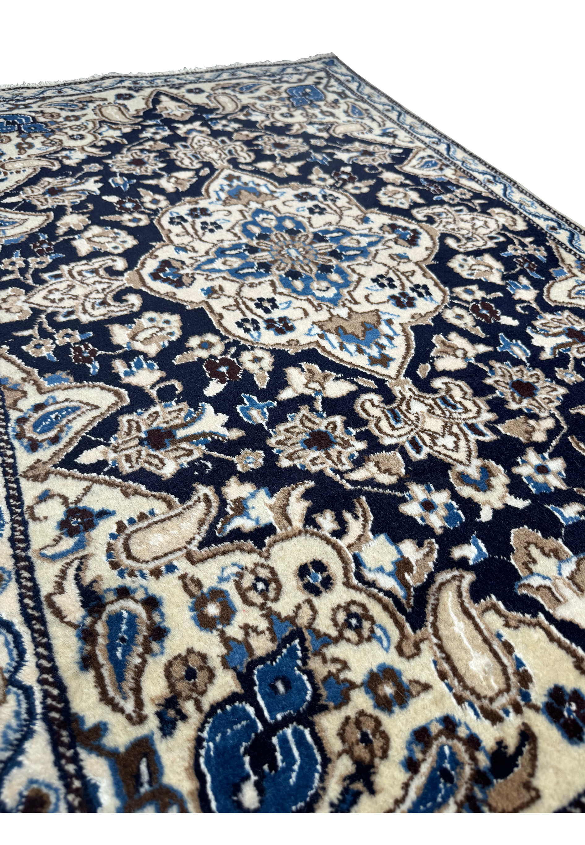 Angled view of 3 x 4'8 Navy Blue Nain Persian Rug displaying depth and texture