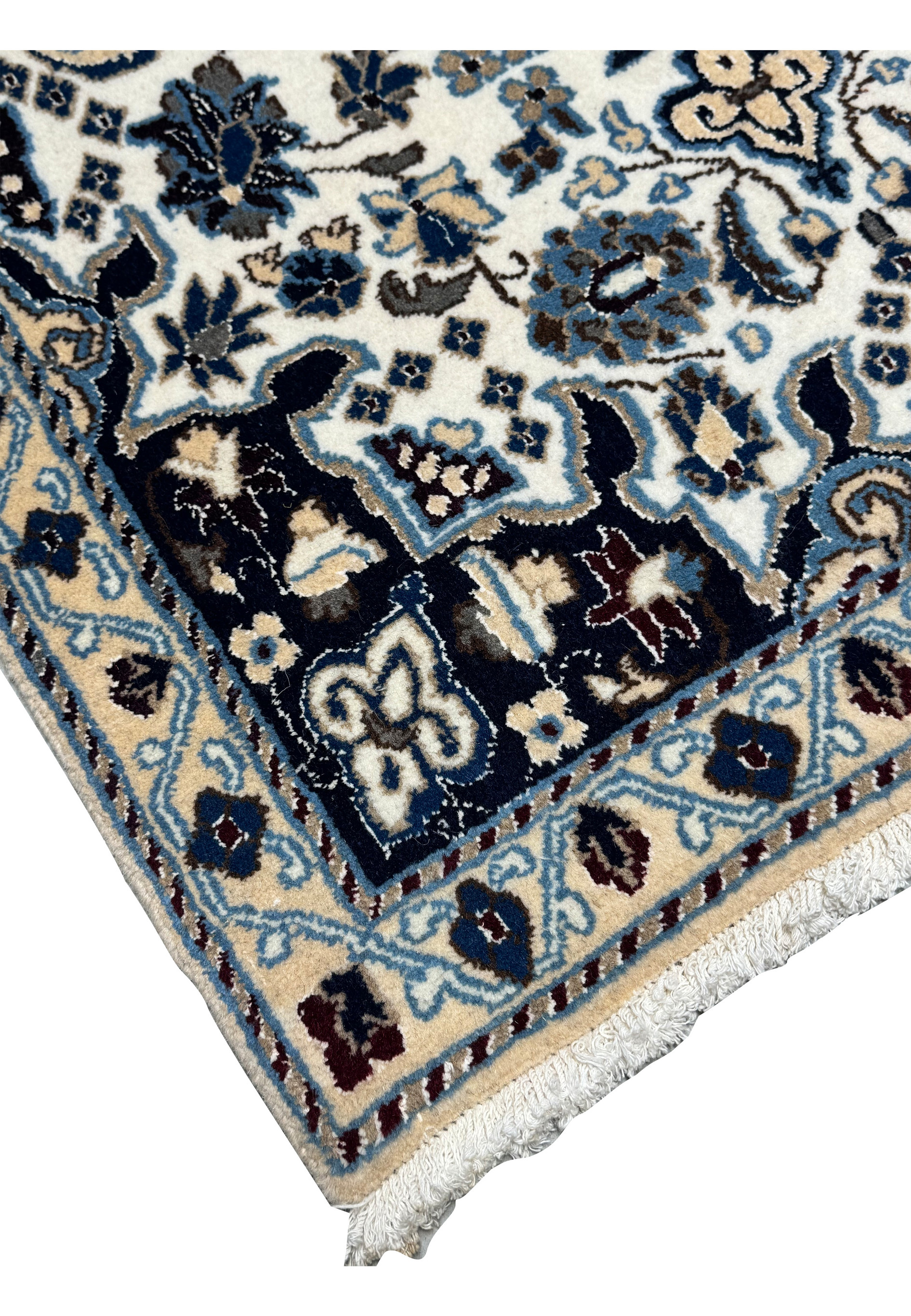 Border close-up of 2'9 x 4'10" Ivory Nain Persian Rug with scrolling navy vine design.