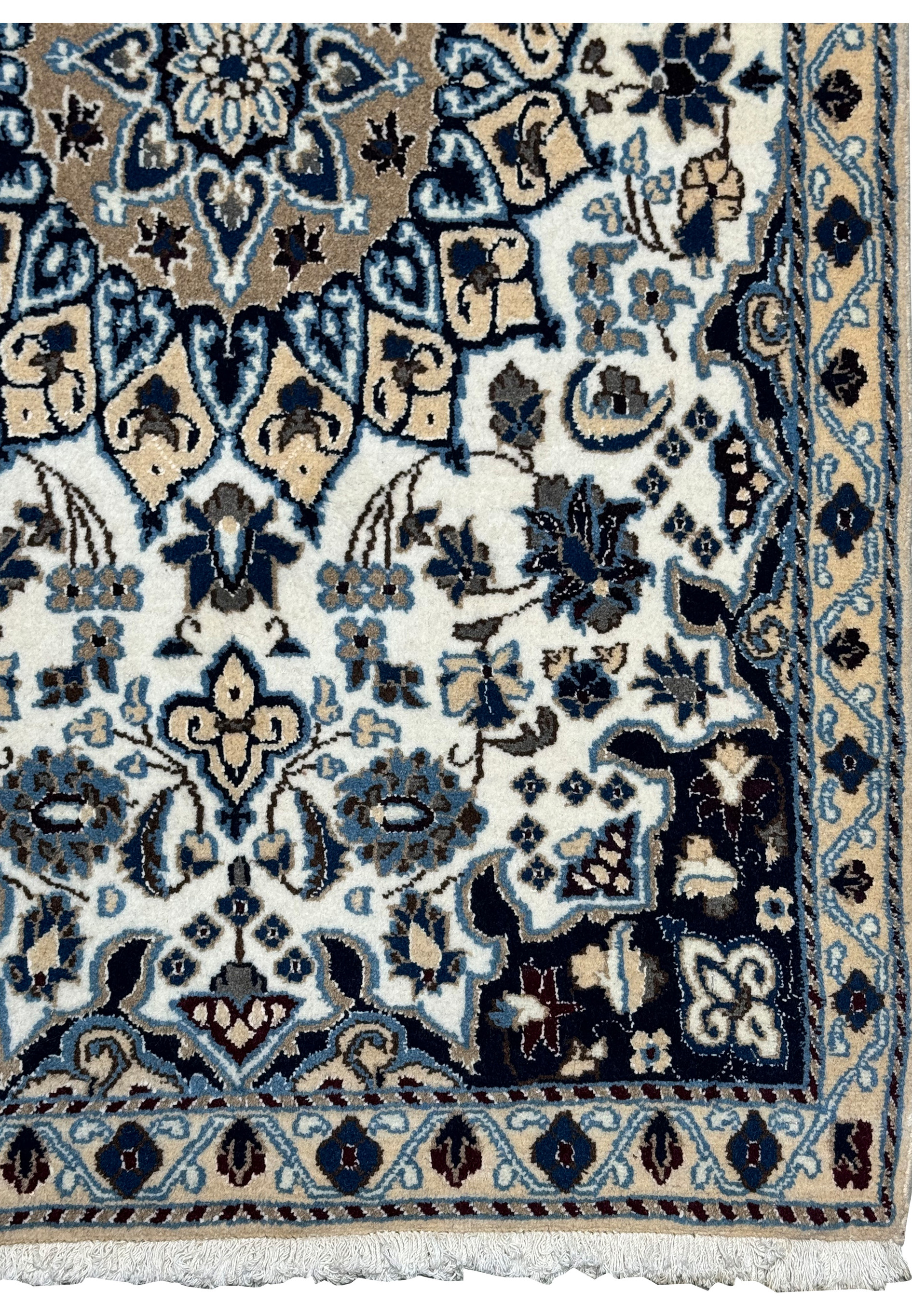 Border detail of 2'9 x 4'10" Ivory Nain Persian Rug with navy ground, ivory blossoms, and scrolling vines.