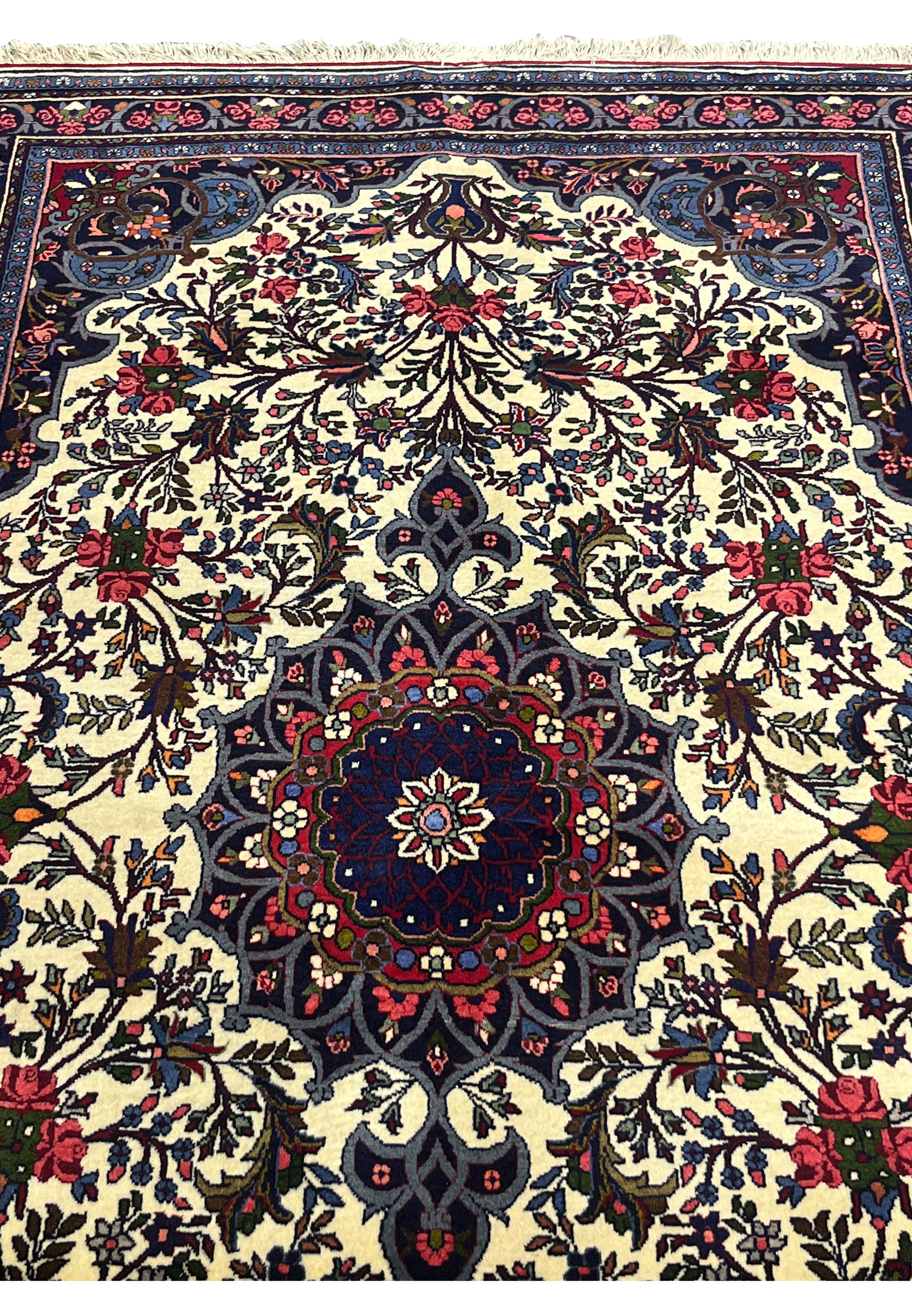Midfield of 4'3 x 6'8 Persian Bijar Rug with ivory background, floral sprays, and navy blue accents