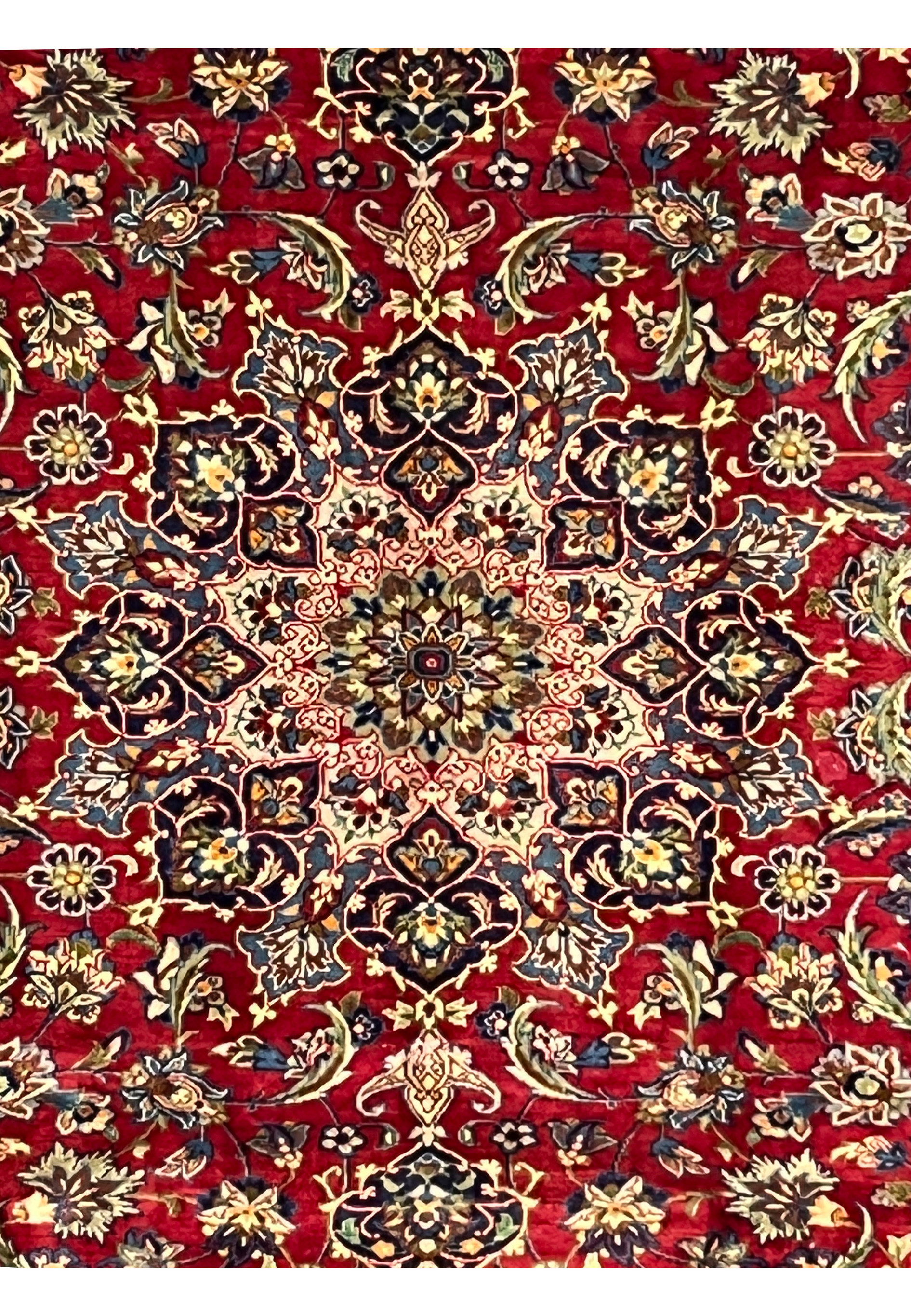 Central medallion of Persian Isfahan rug with navy, ivory, and gold accents