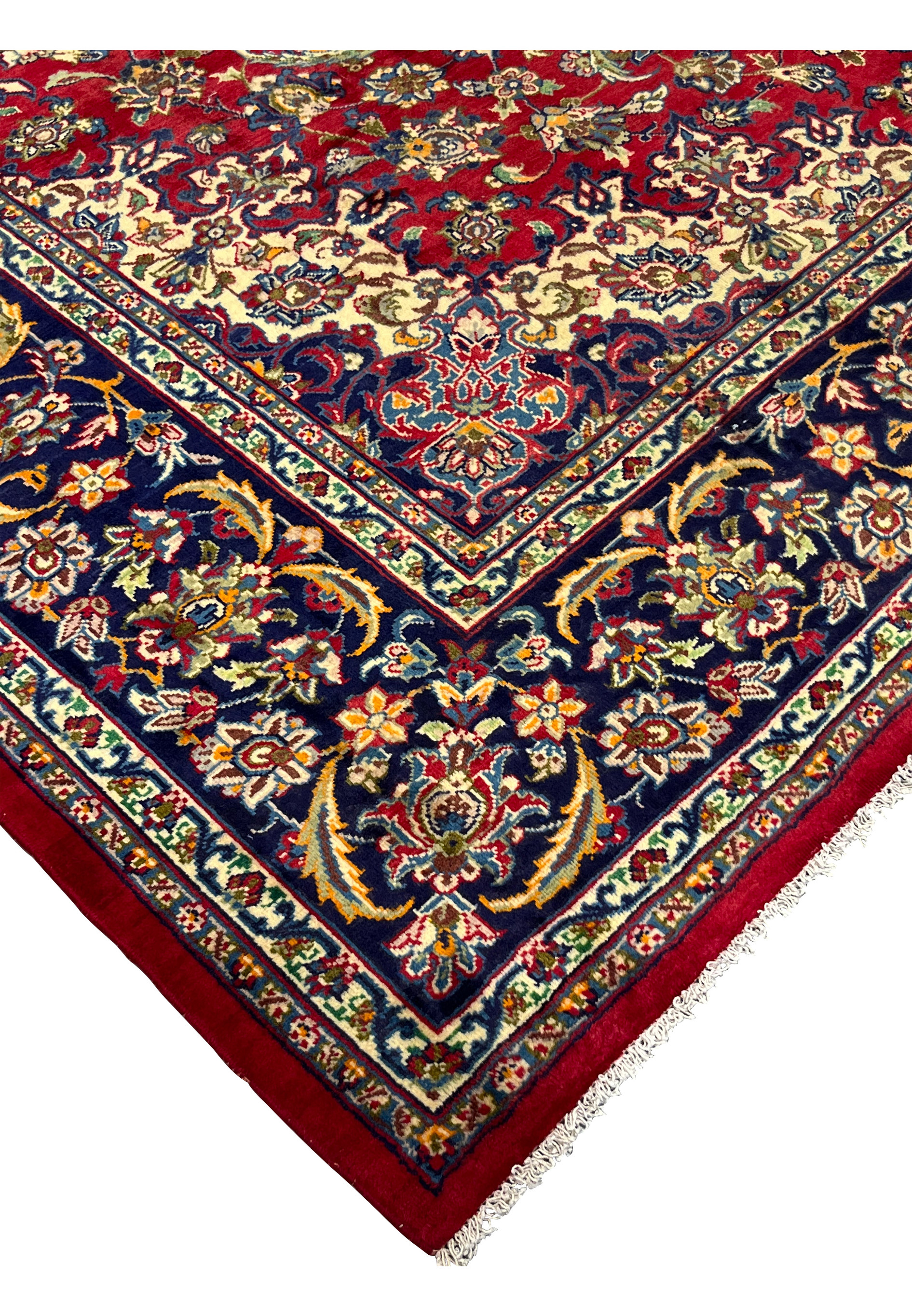 Close-up of Isfahan rug fringe and navy border detailing