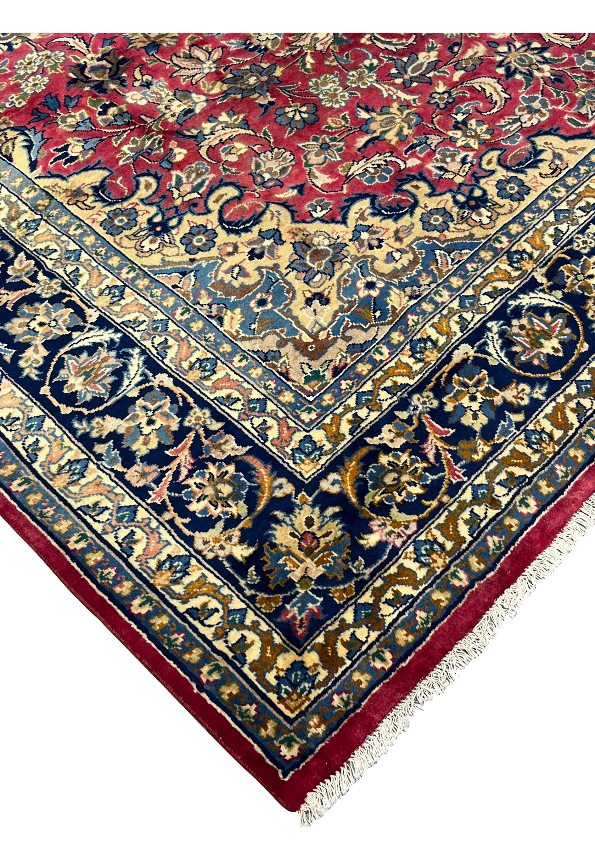 Angled corner view highlighting the rug’s dense pile, fine knotting, and aged patina in traditional Isfahan artistry.