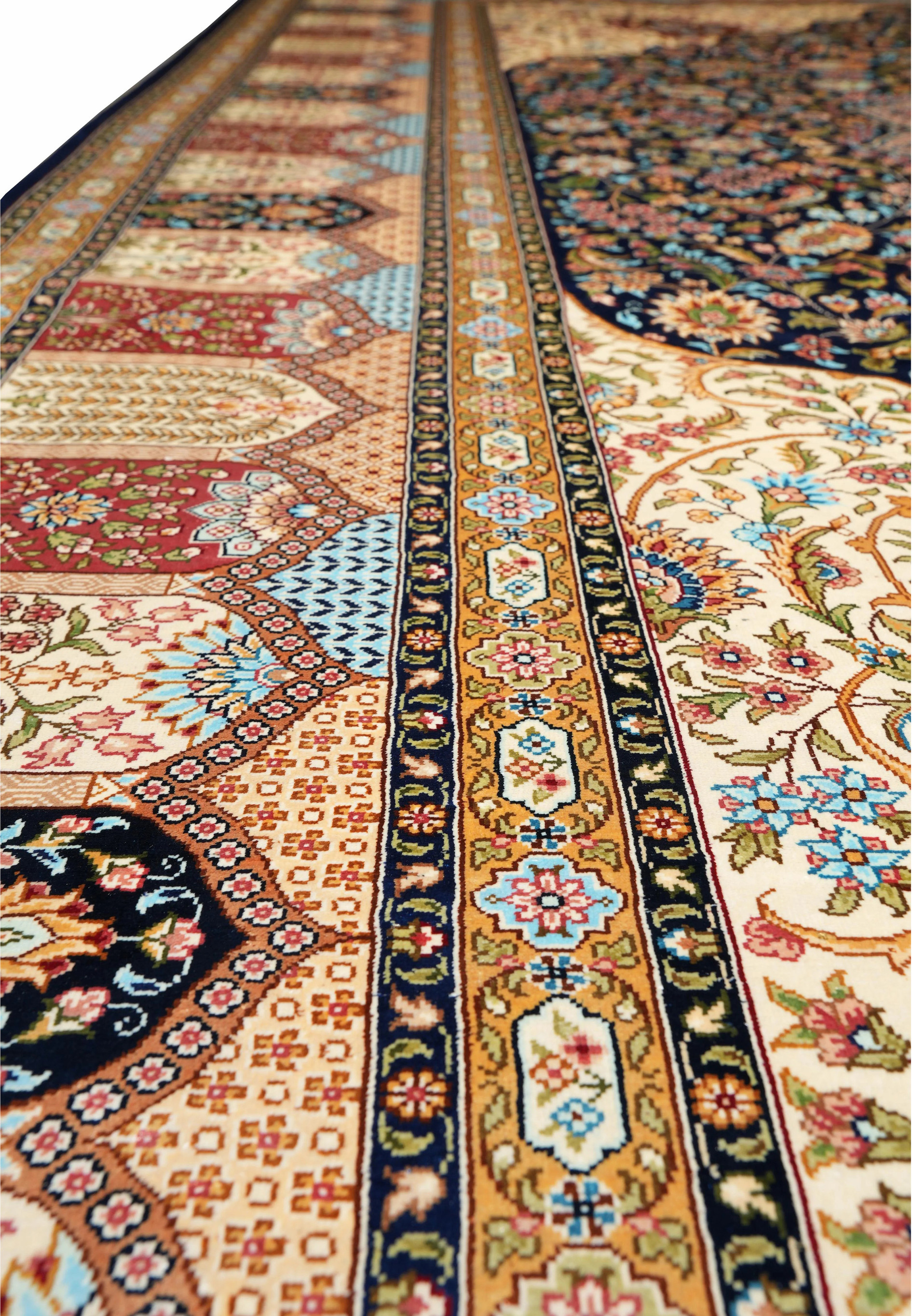 Side border view emphasizing the repeating rosette and vine motifs on a navy field with golden outlines.